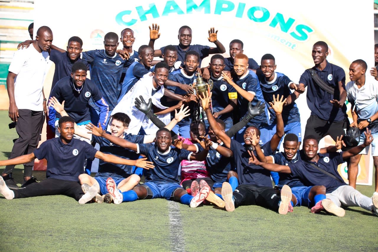 The team is cheering after winning a football tournament.  