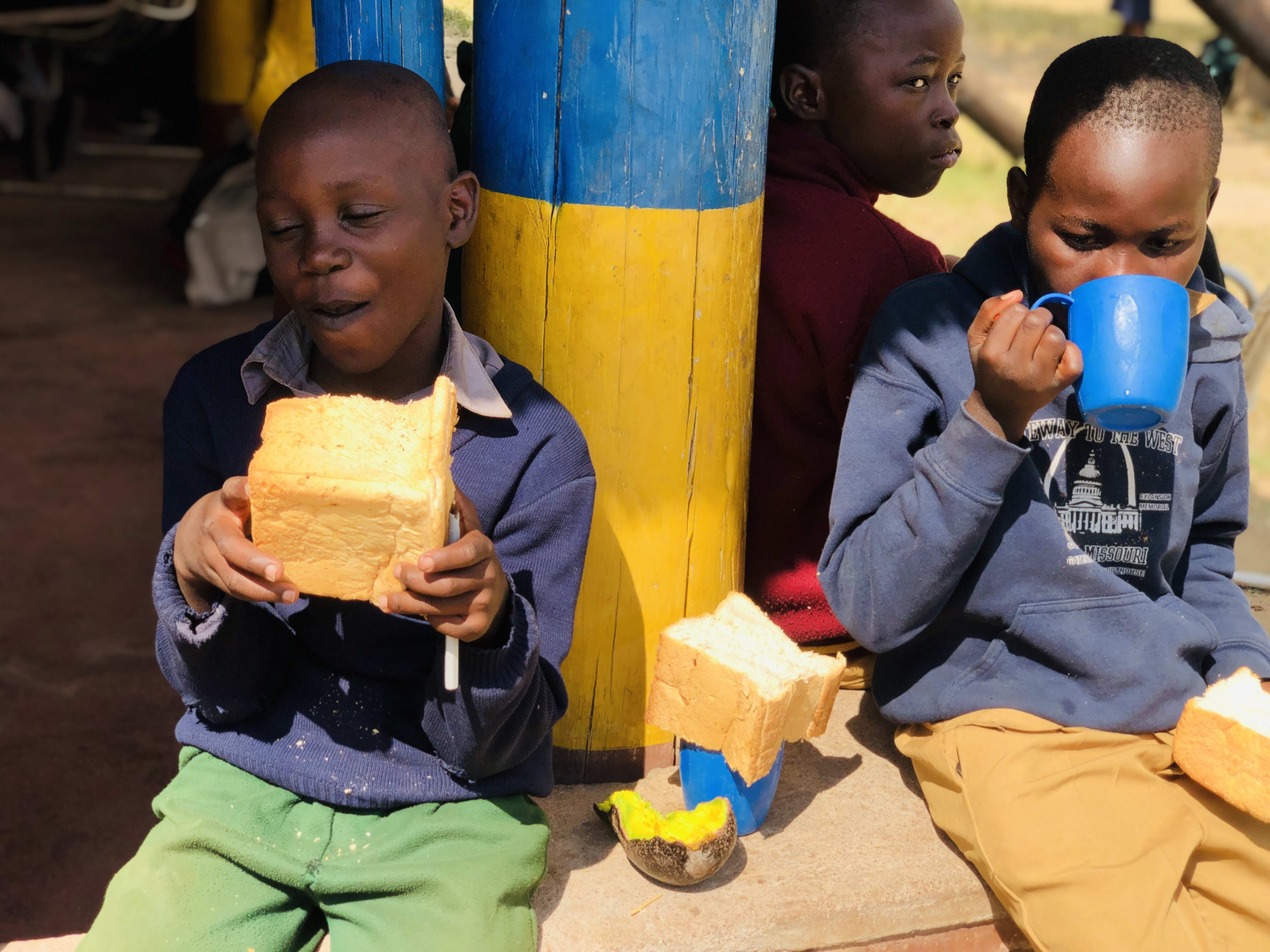 Out of school children at tea time Chiedza