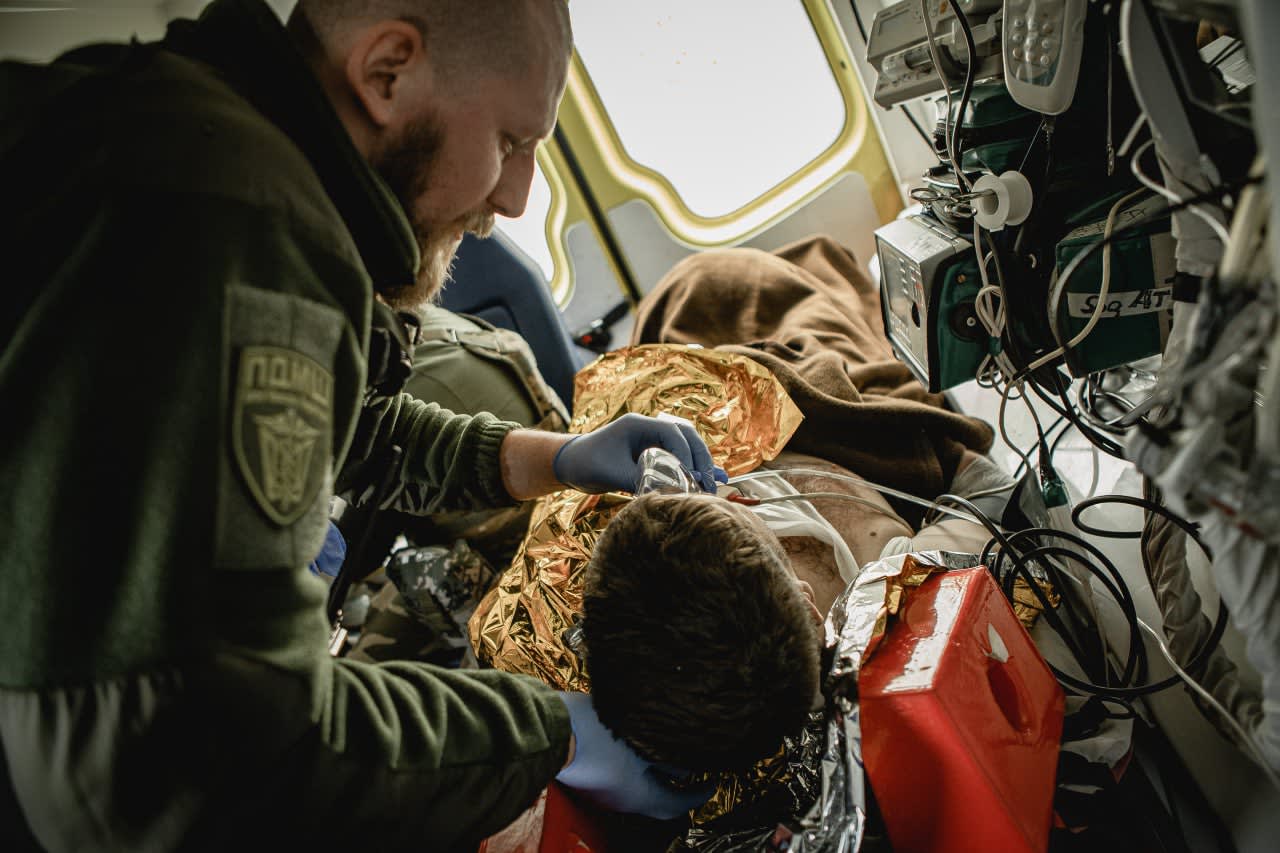 PDMSh medic evacuating a critically wounded patient