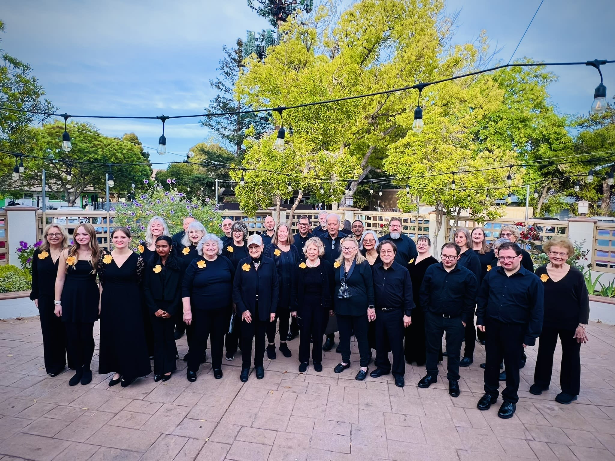 South Bay Military Veterans Chorus dressed in concert black preparing to perform.