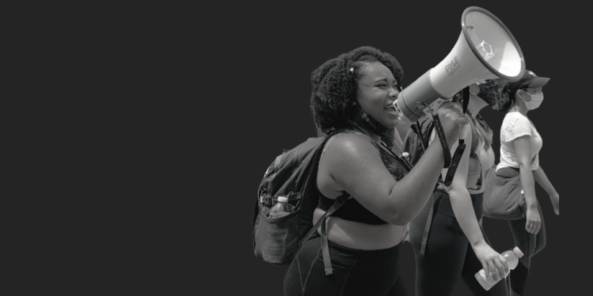 Woman accompanied by two others chants with a megaphone in Washington DC 6/6/2020 (IG: @clay.banks)