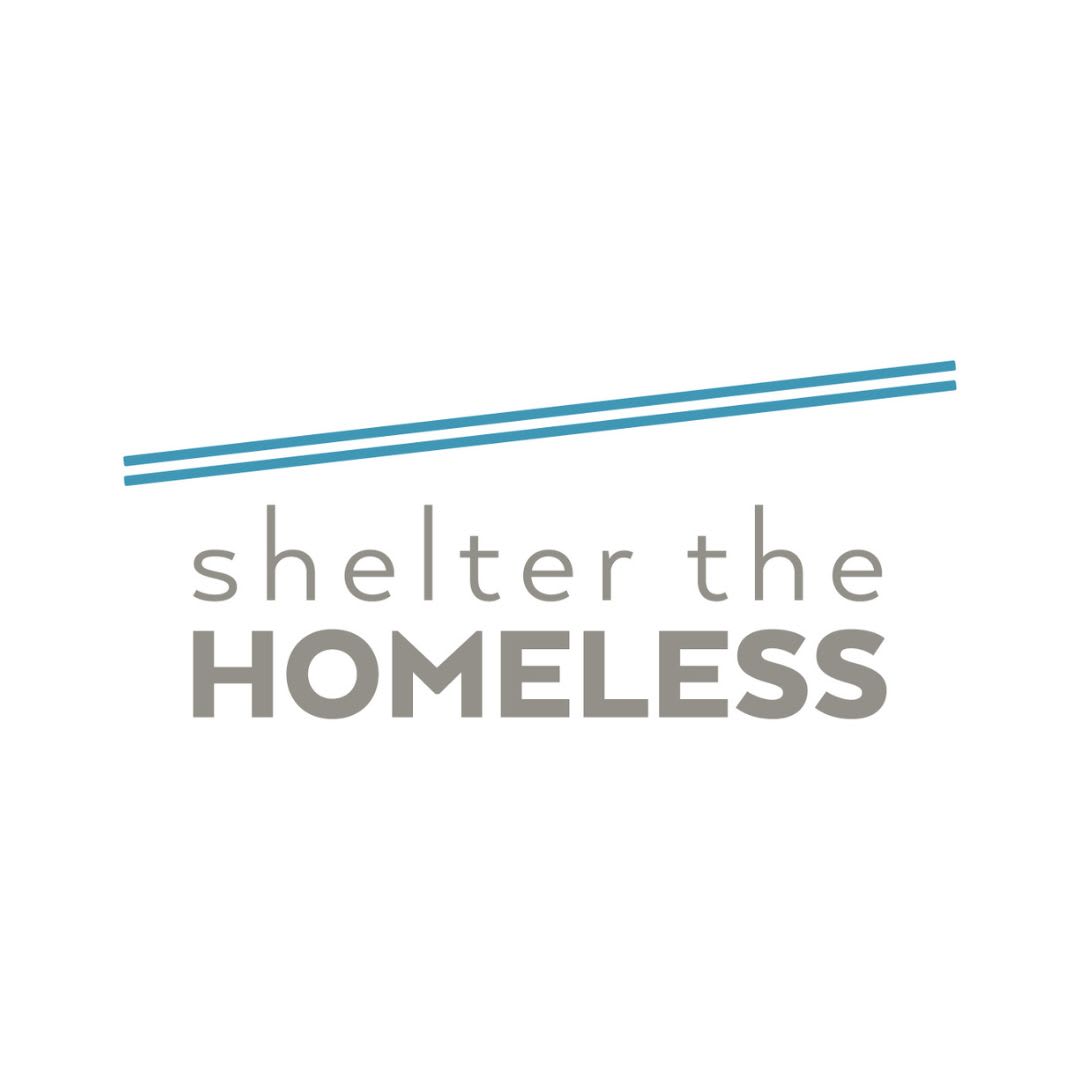 Shelter the Homeless logo: gray text that reads "shelter the homeless" with angled blue lines above the text that represents a roof