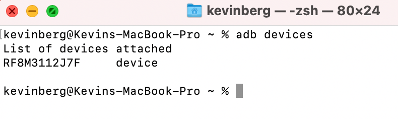A Mac terminal window showing the output from an adb devices command. One devices is attached.