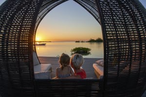 woman and child watching sunset