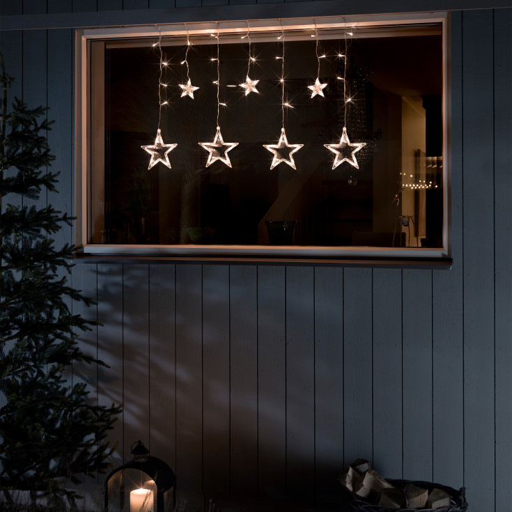 Konstsmide ljusgardin utomhus, 7 bärnstensfärgade ljus, stjärnor