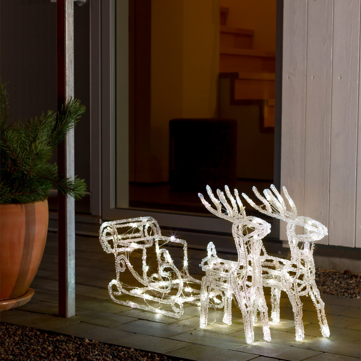 Konstsmide rensdyr med slæde