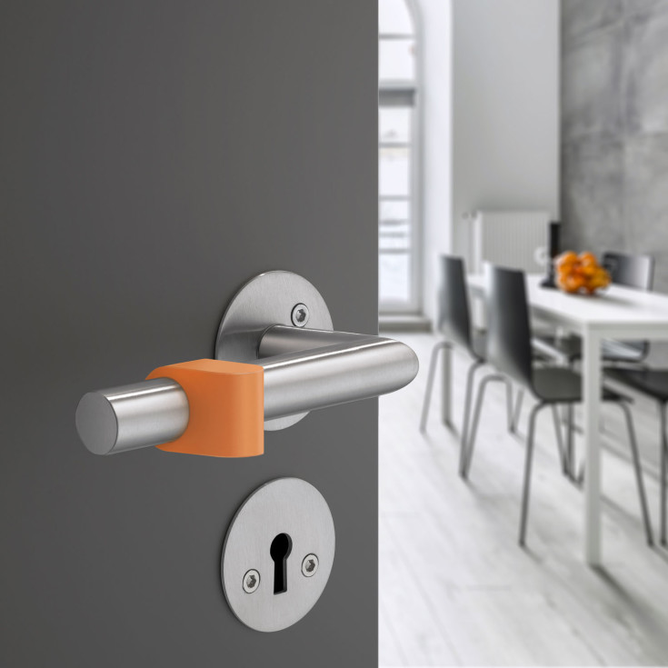 Beslagsboden dørstopper for dørhåndtak, oransje