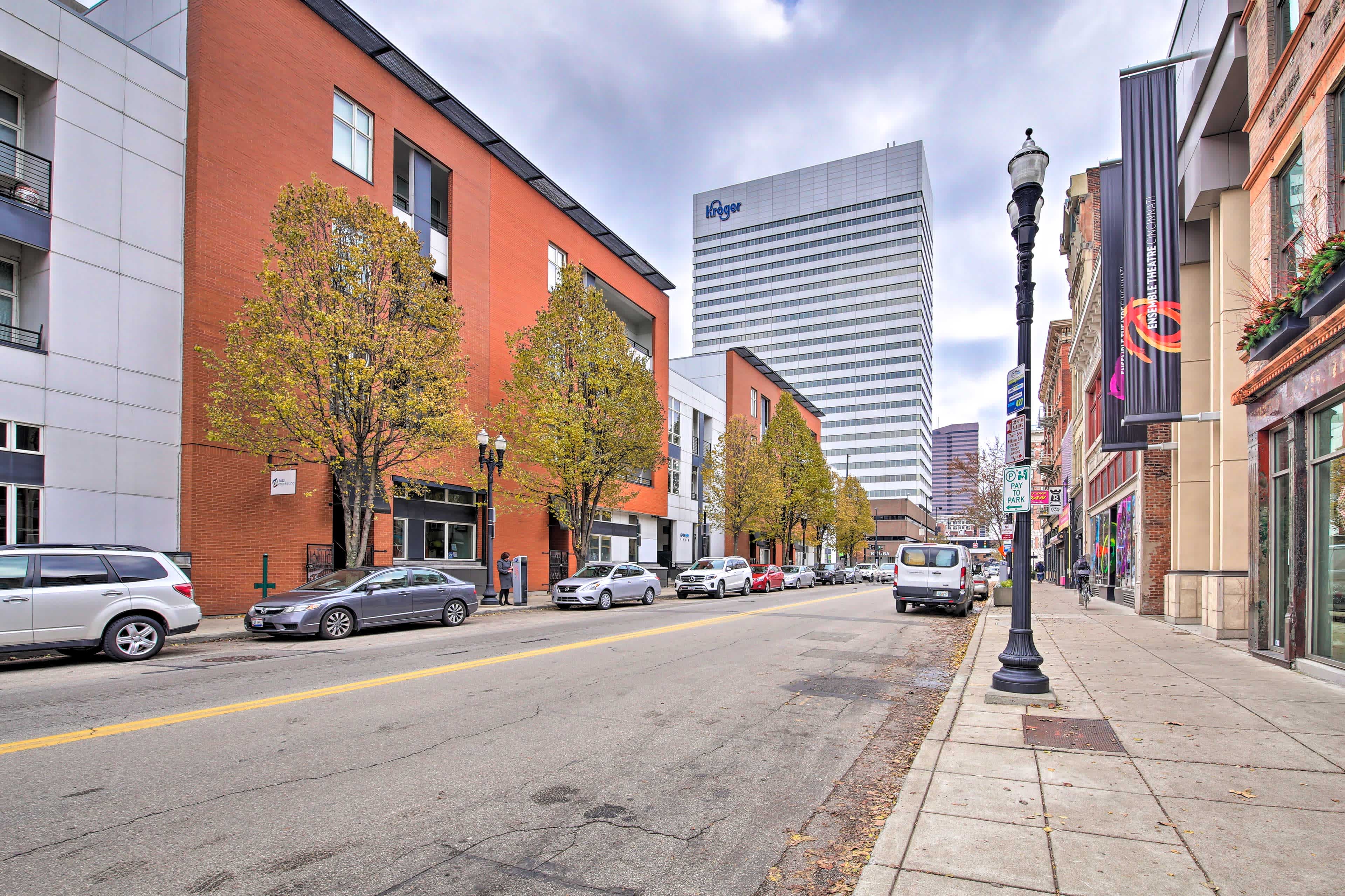 View down a downtown street with high rise buildings in Cincinnati, OH