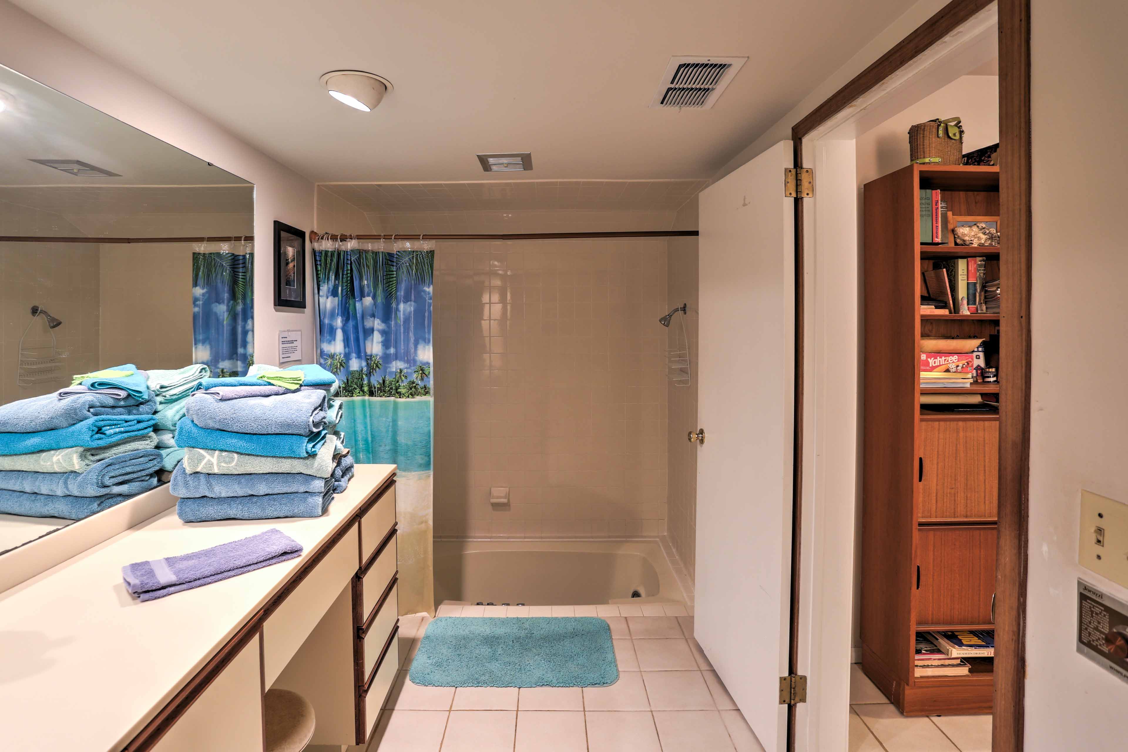 Rinse off before bed in the en-suite bathroom's shower/tub combo.