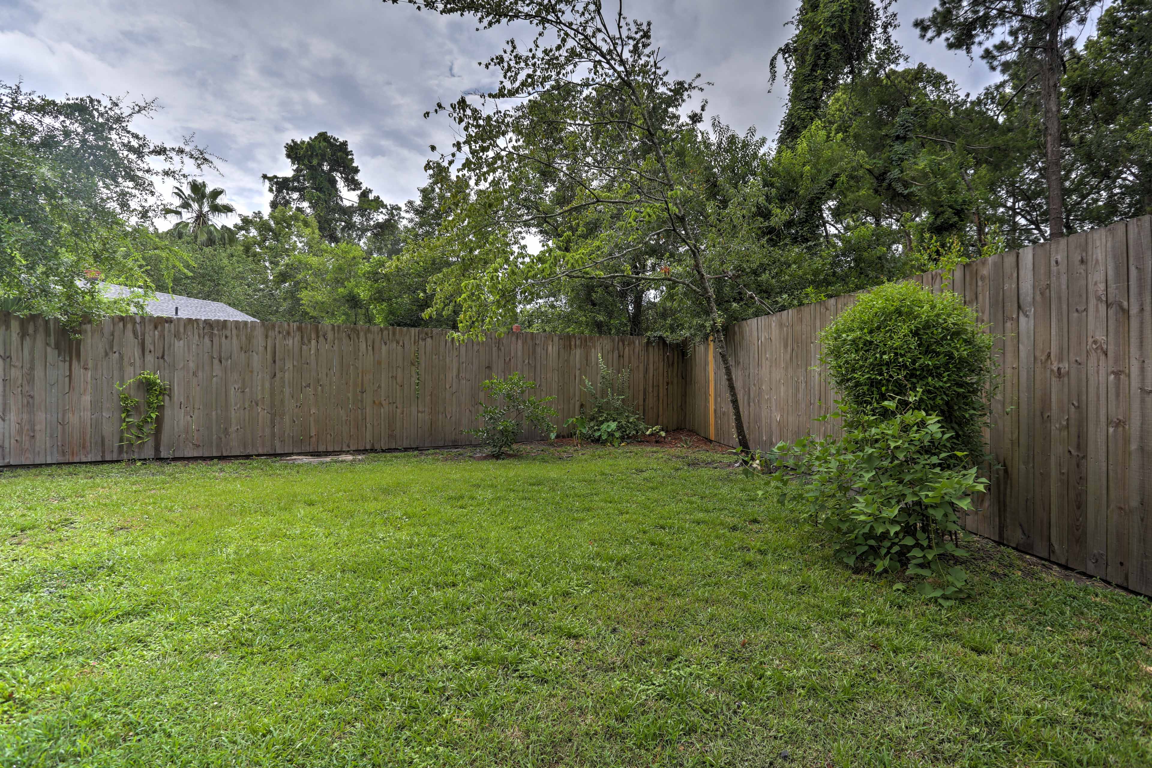 The backyard is perfect for lawn games and is fenced for added privacy.