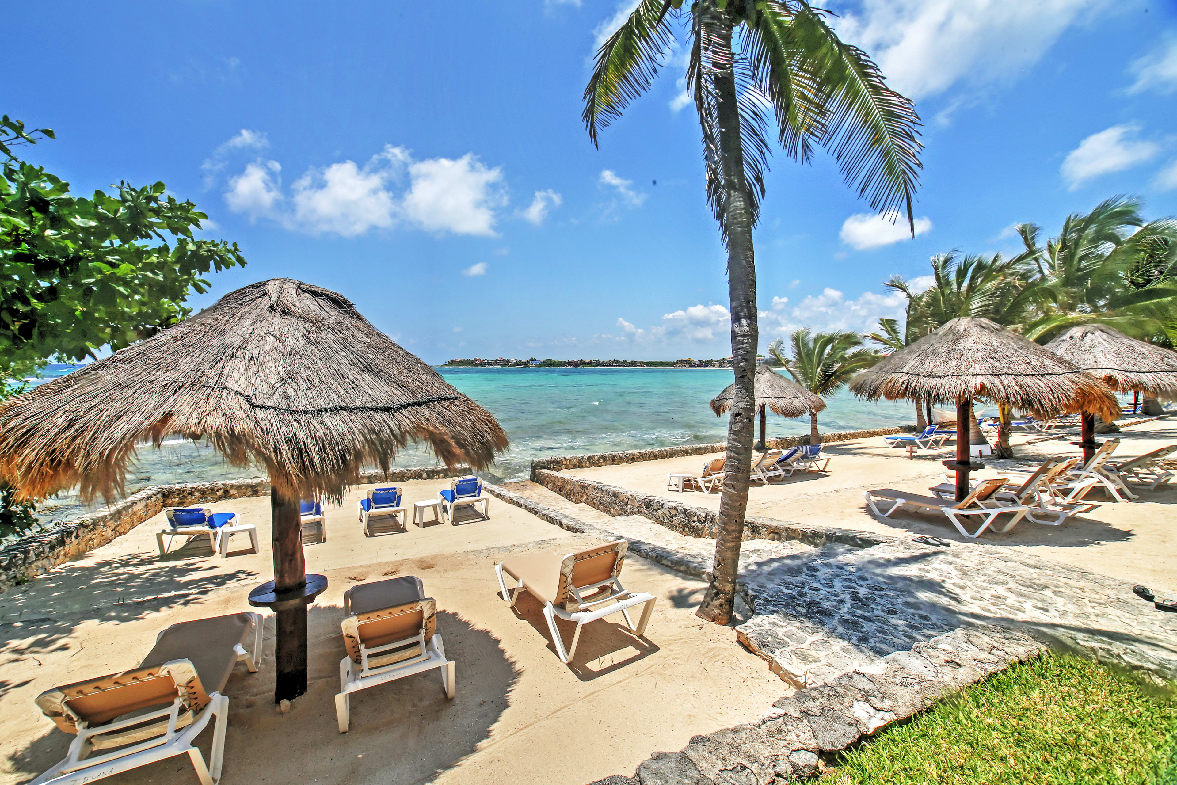 Sip a Corona as you lounge beneath a palapa on the private beach.