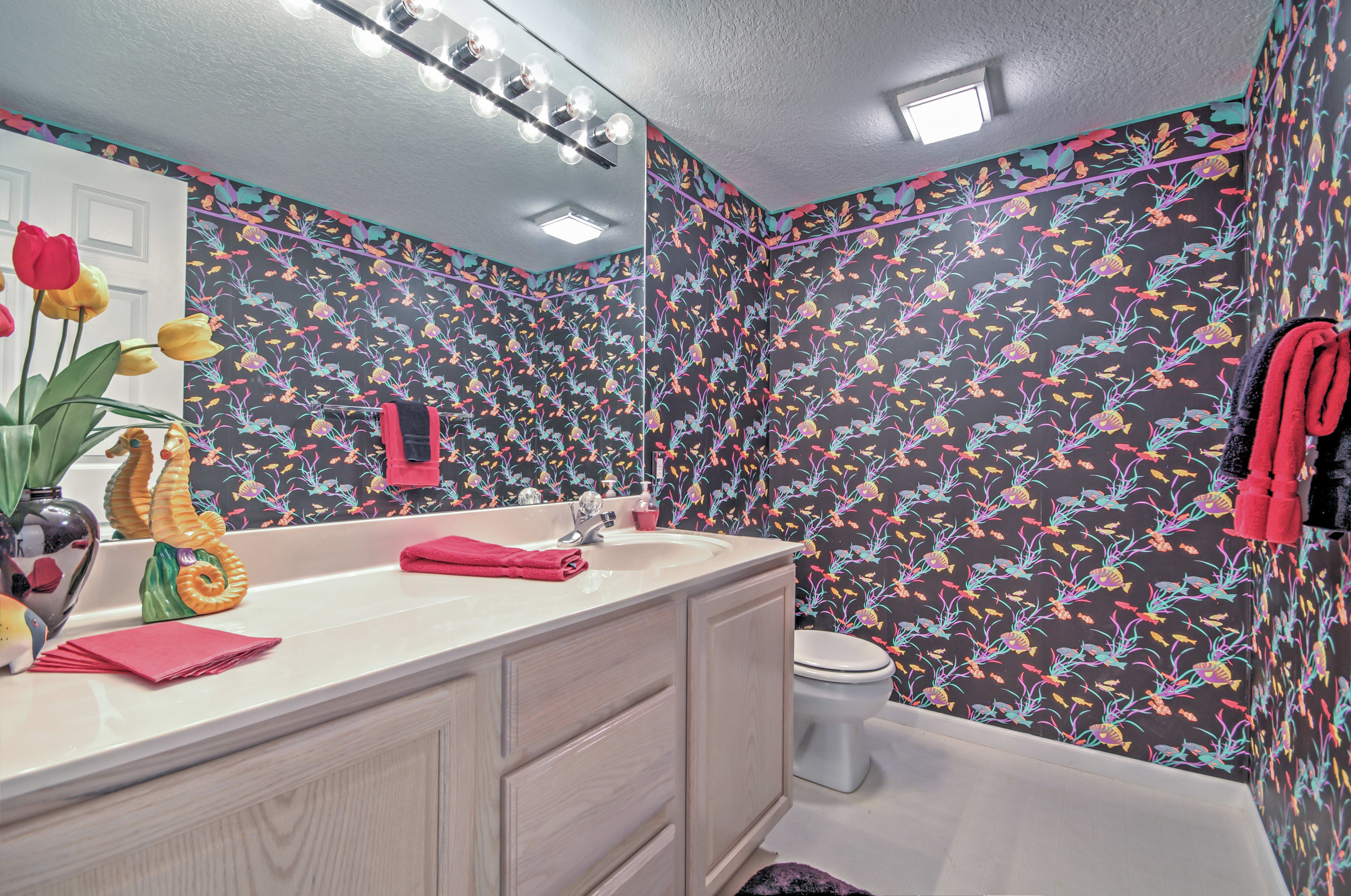 Take advantage of the counter space when you're getting ready for the day in this colorful bathroom.