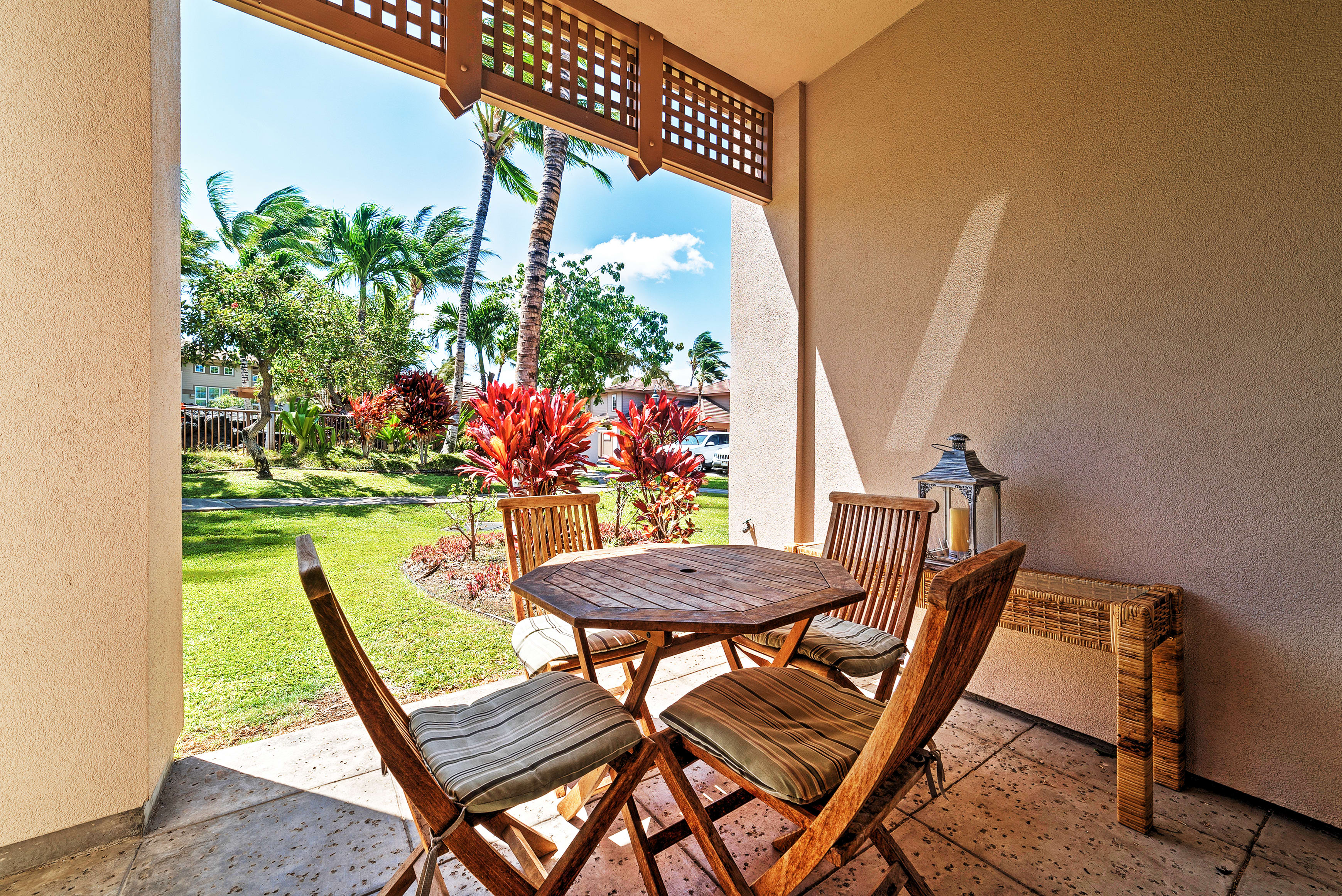 Sip your morning coffee on the private patio overlooking beautiful palm trees.