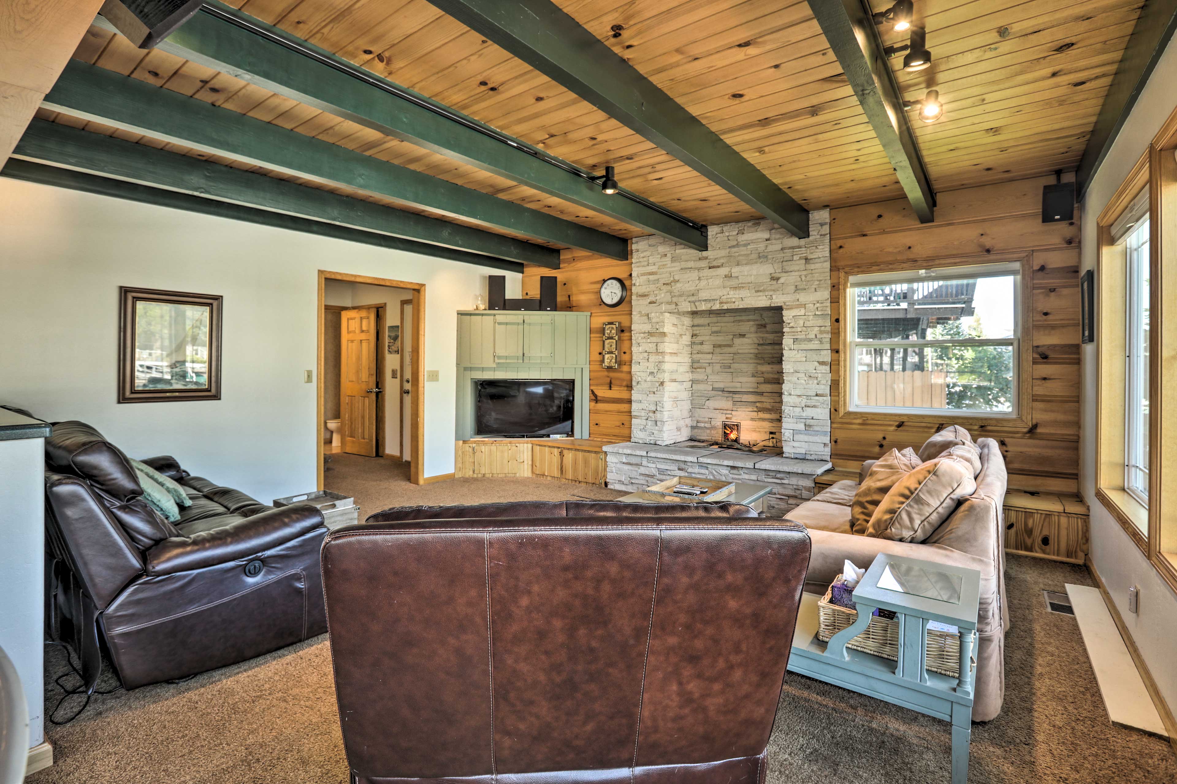 The living room couch converts into a queen bed for additional sleeping.