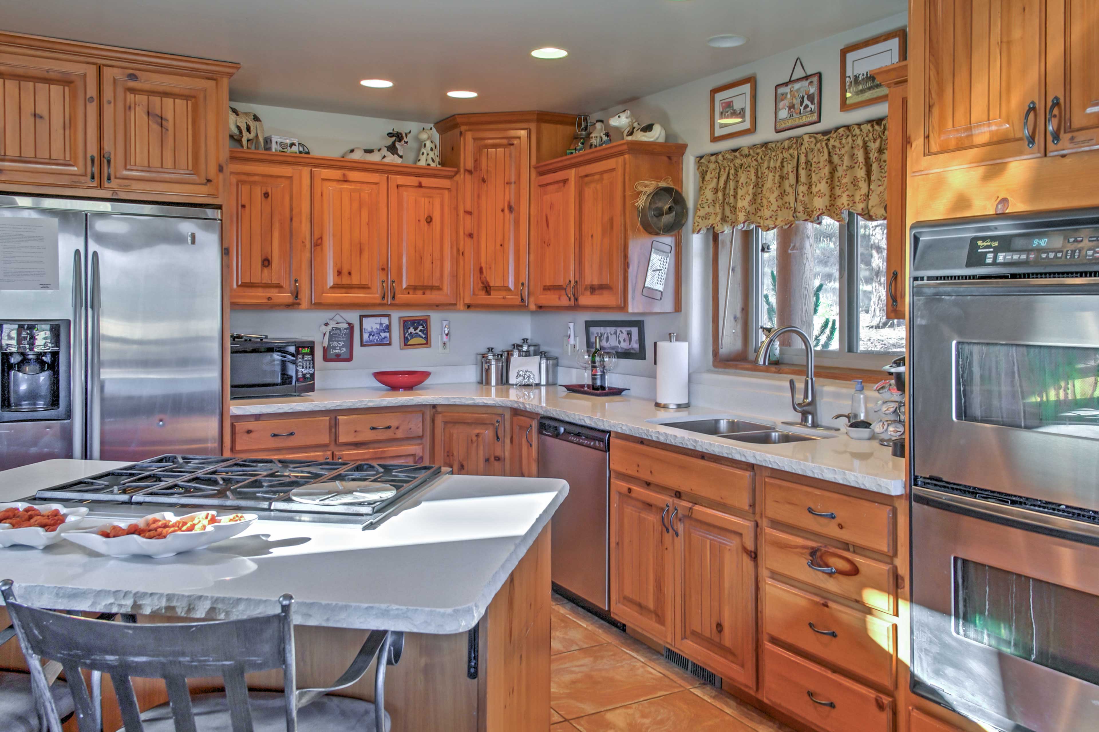 The kitchen is fully equipped with all of the necessary cookware.