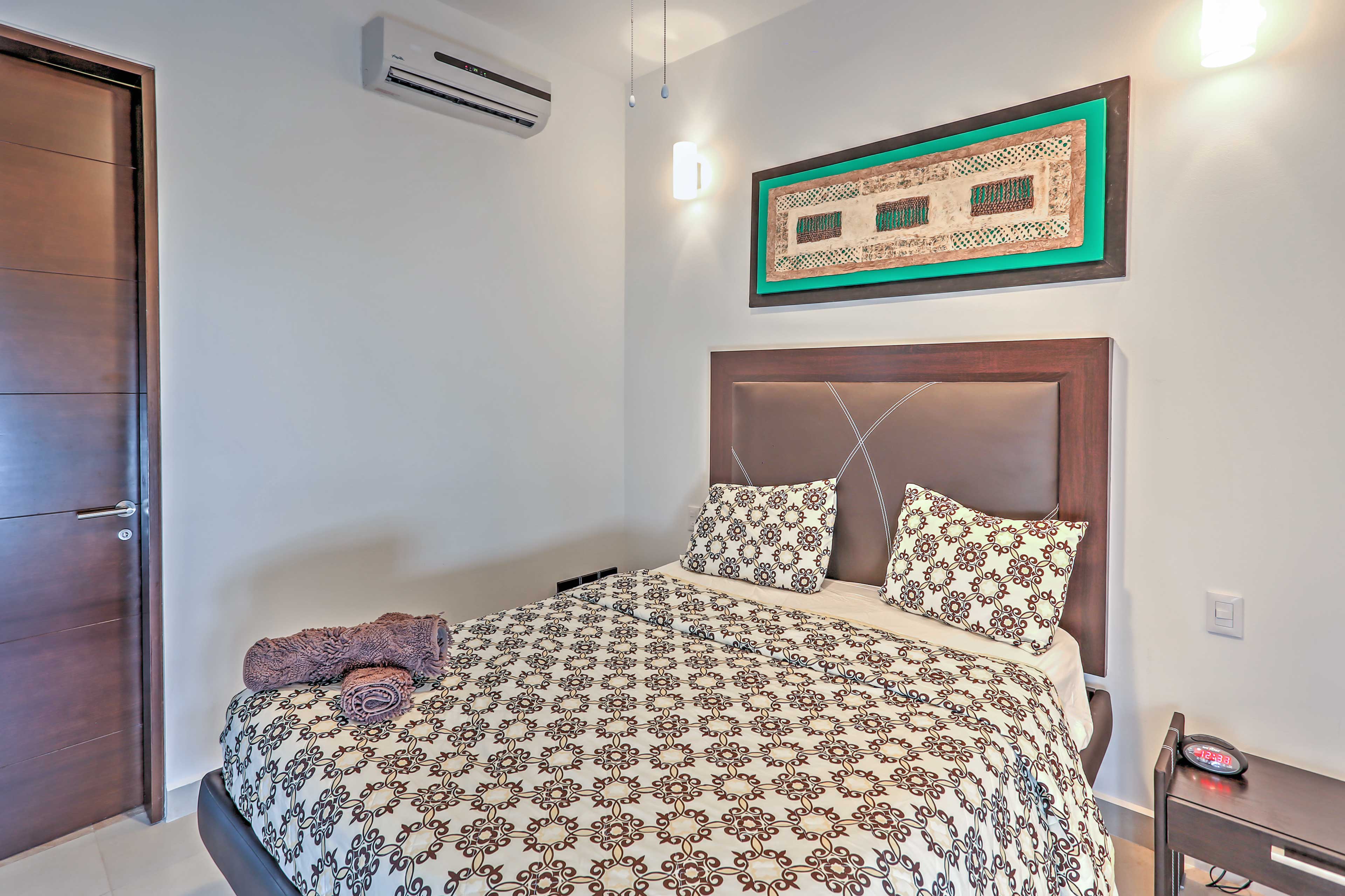 Sink into the second bedrooms queen bed and turn on the air conditioning!