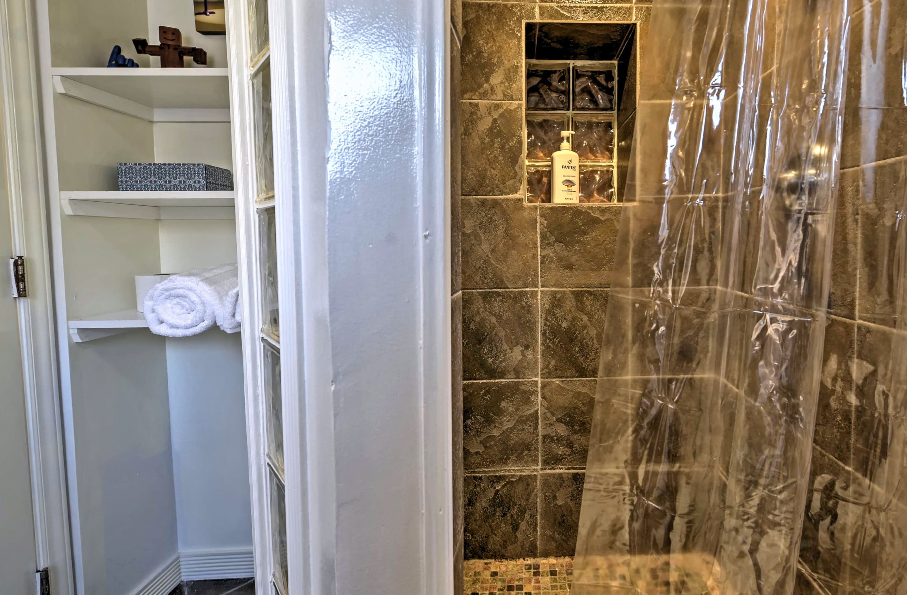 Take a cleansing rinse in the walk-in shower.