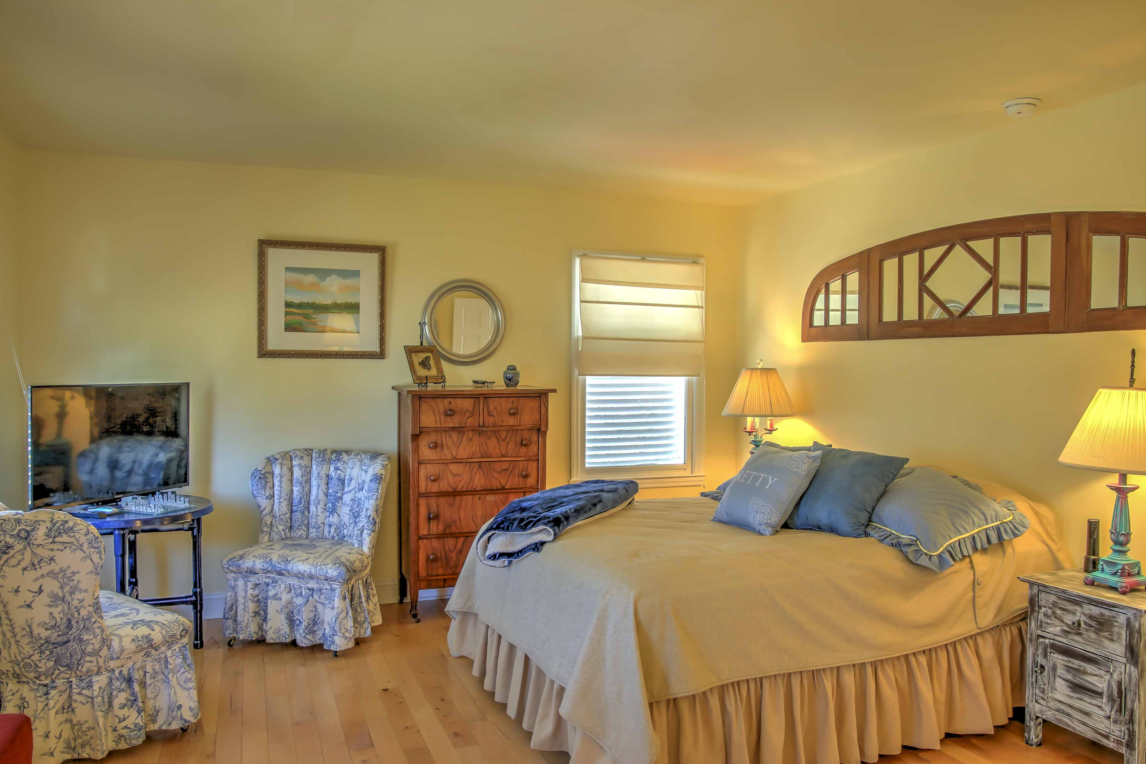 This bedroom features a plush queen-sized bed.