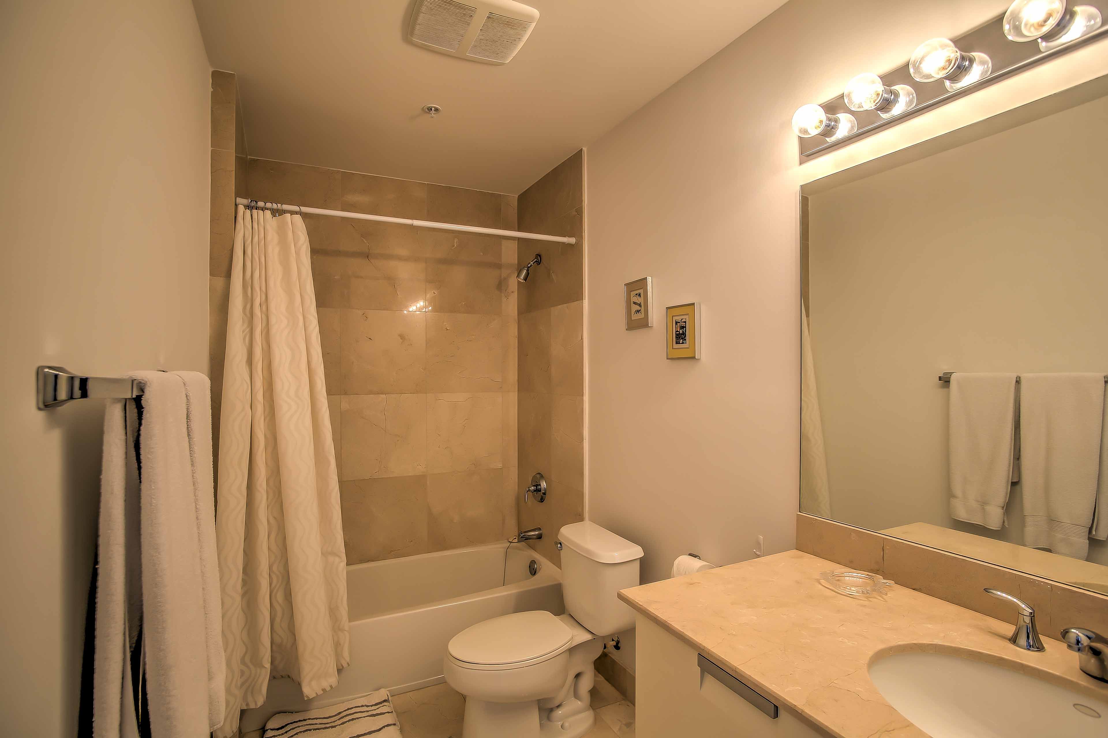 Primp for a night on the town in this pristine bathroom.