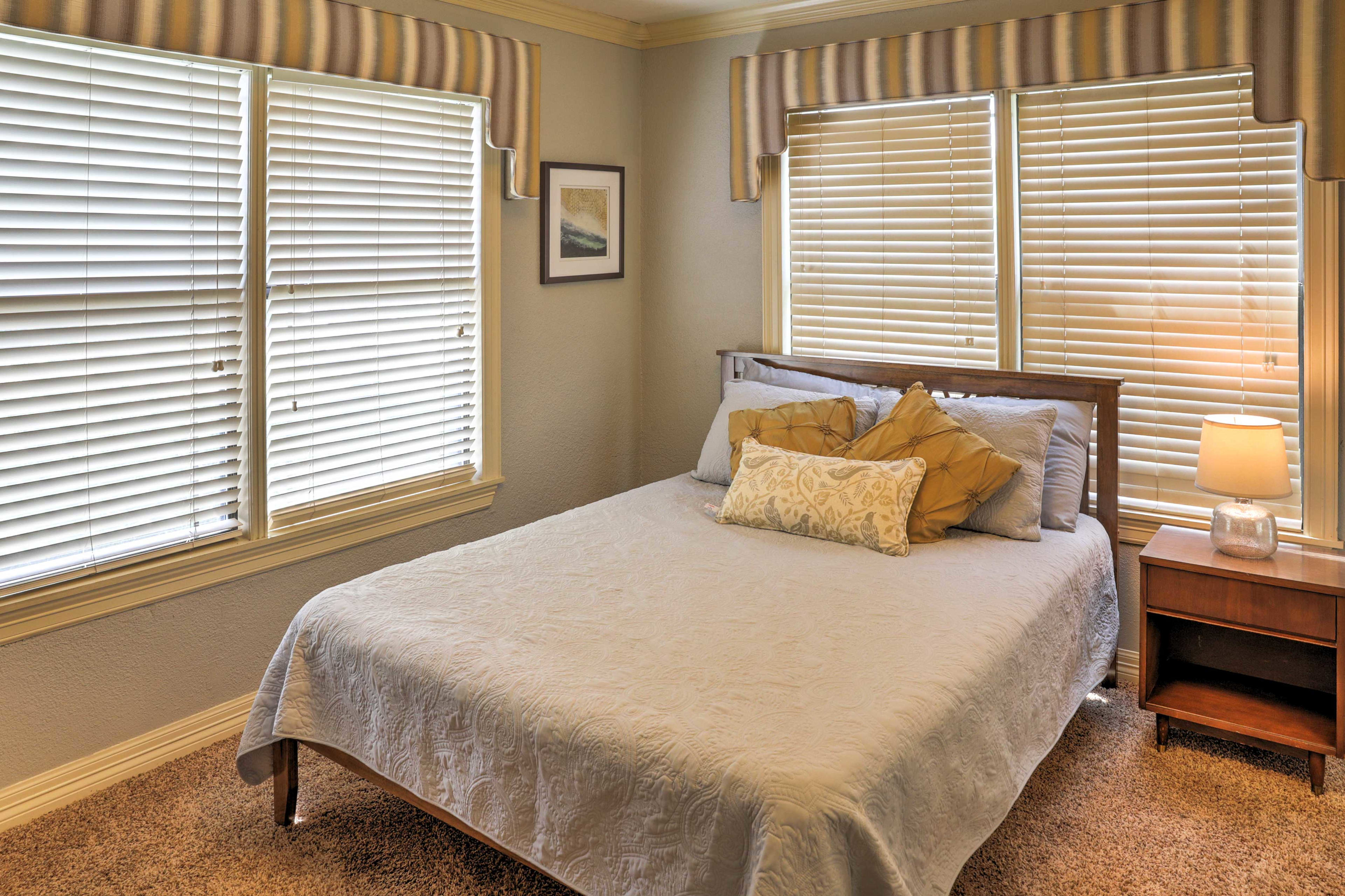 The first bedroom features a comfortable queen-sized bed.