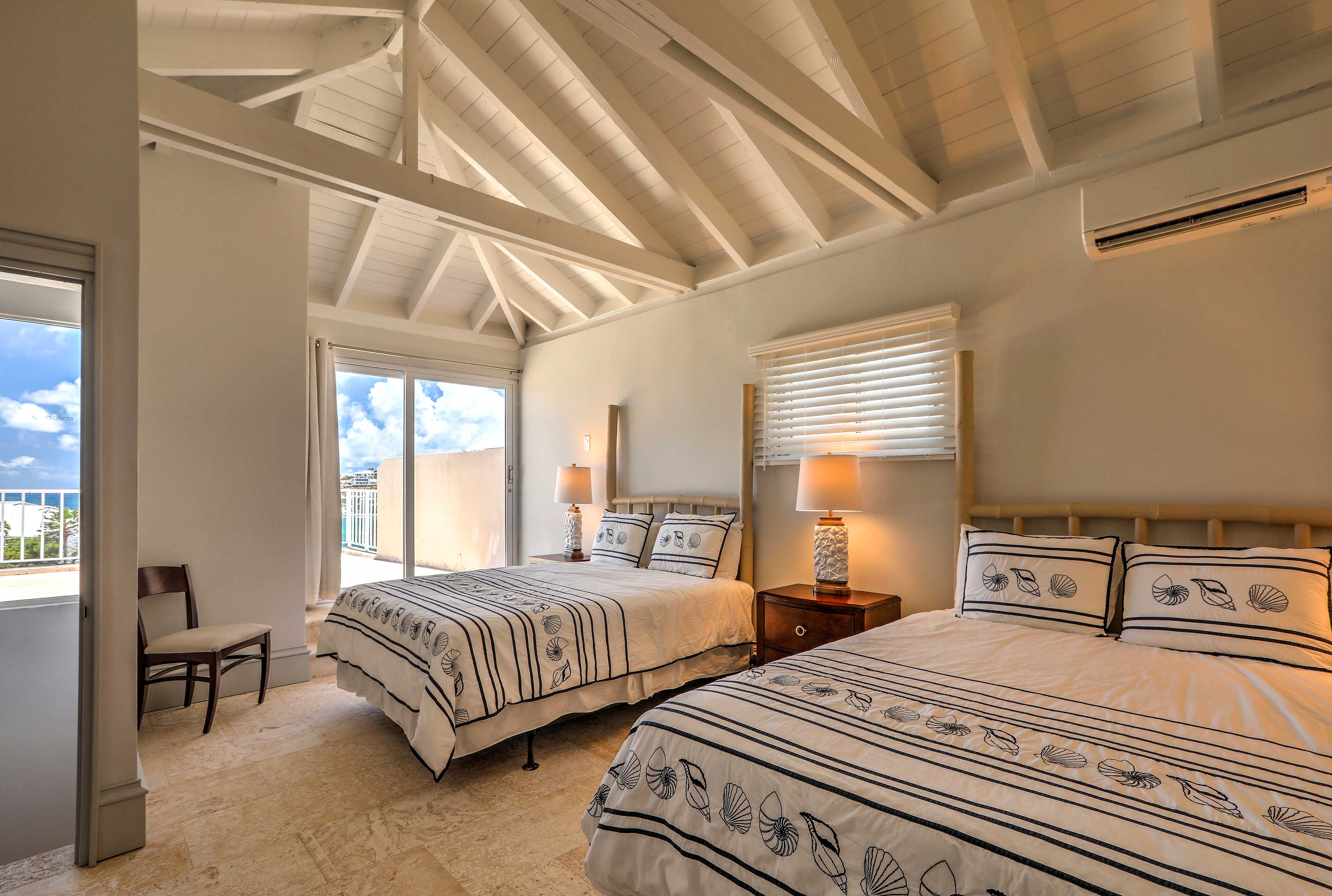 Lofted beams and bright windows open this space up!