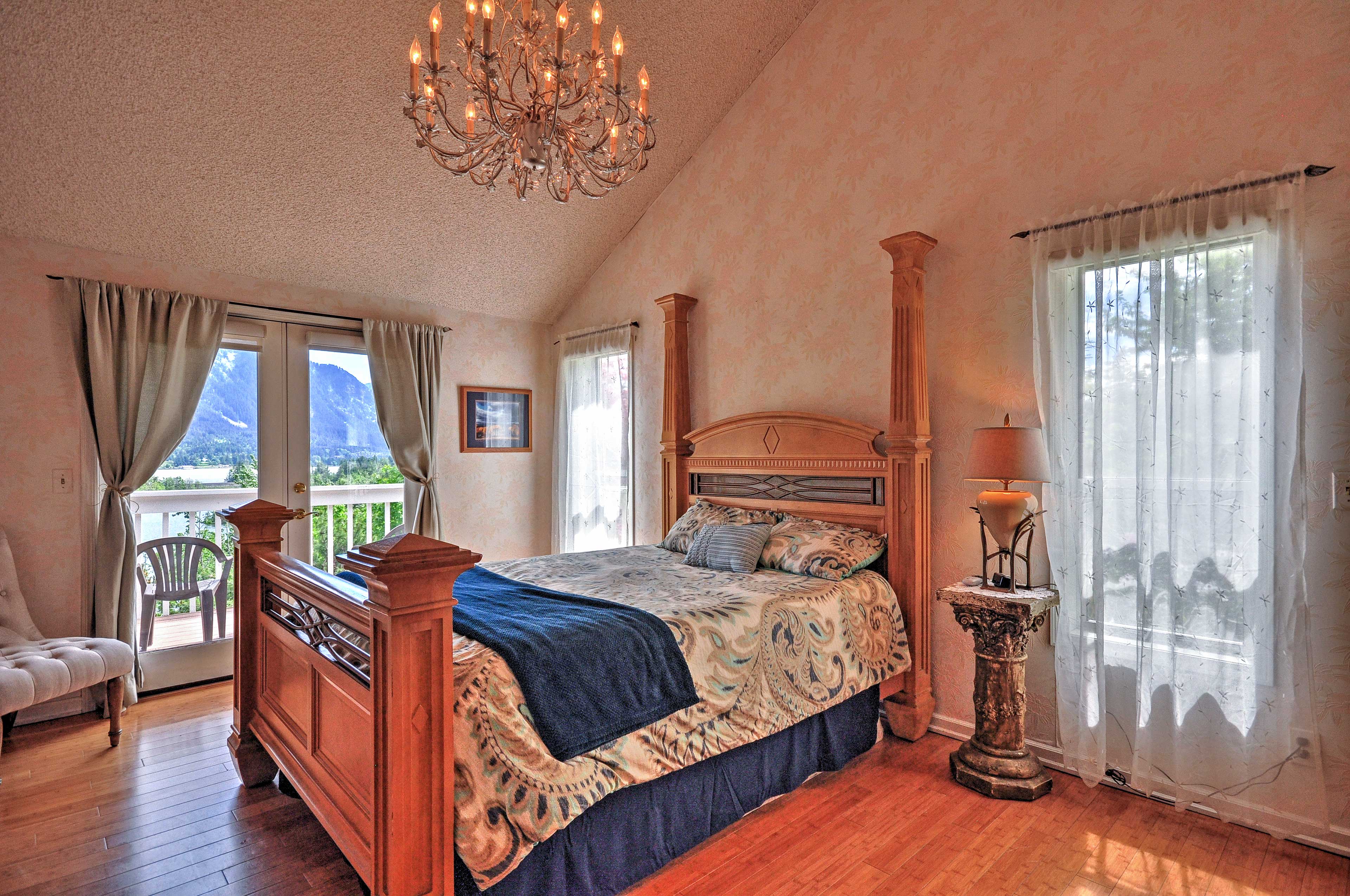 The spacious first bedroom features a grand queen bed.