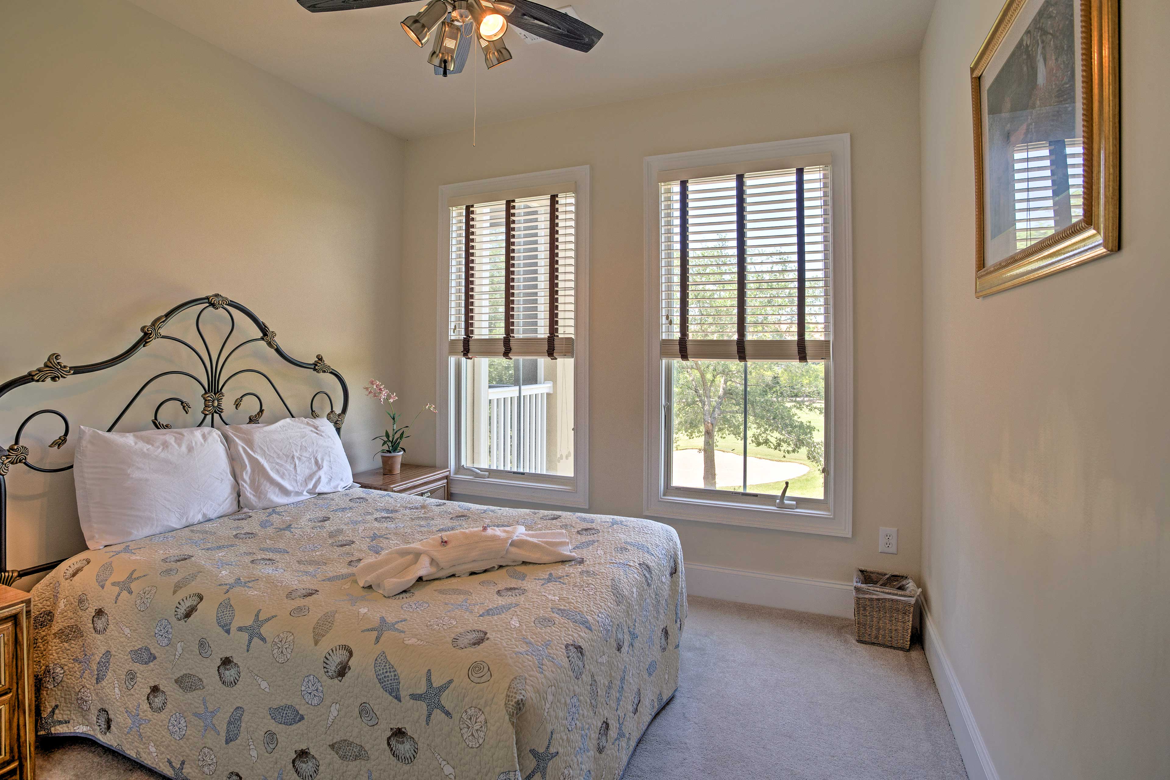 The guest bedroom offers an additional queen bed.