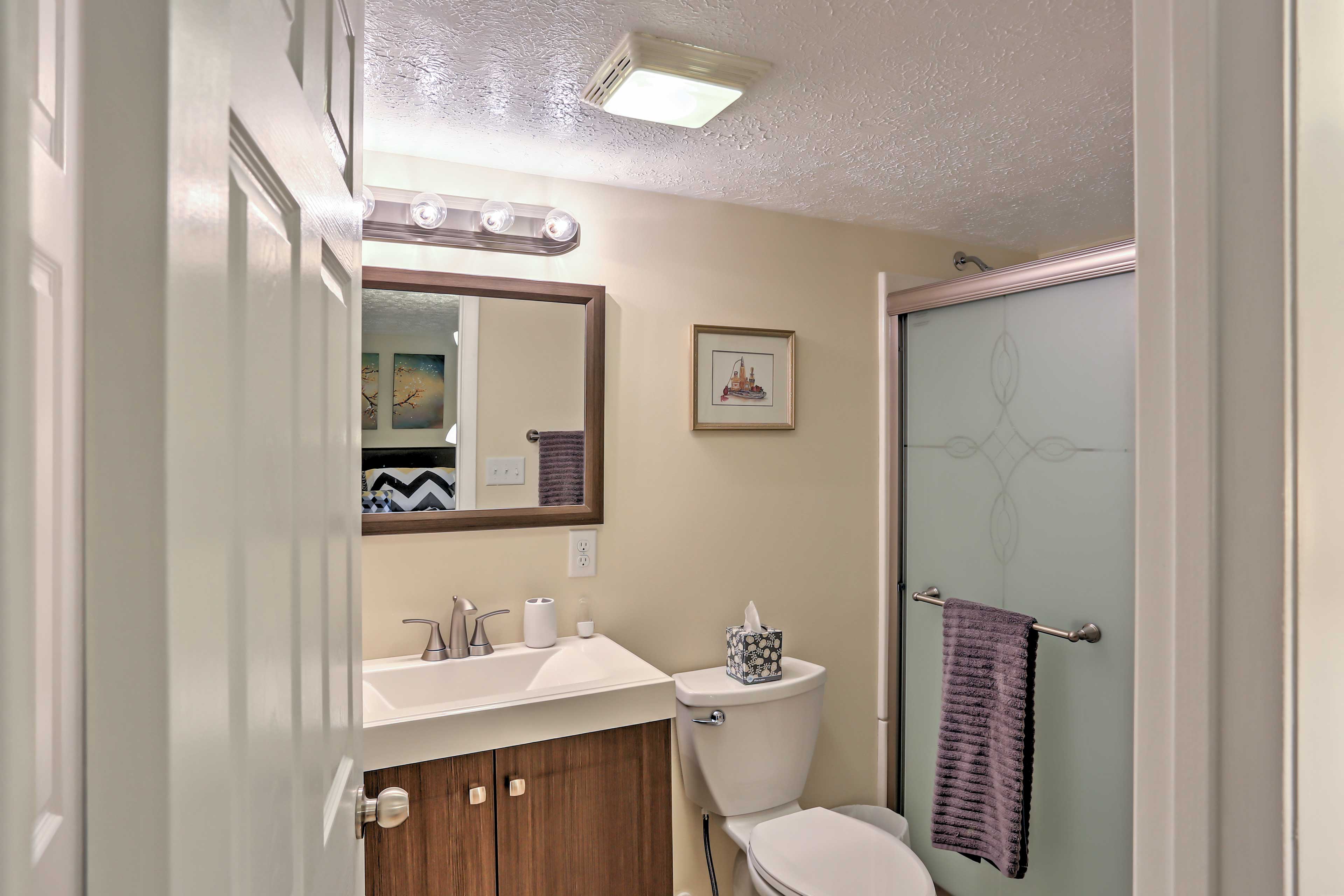 The bathroom boasts brand new, stylish fixtures.