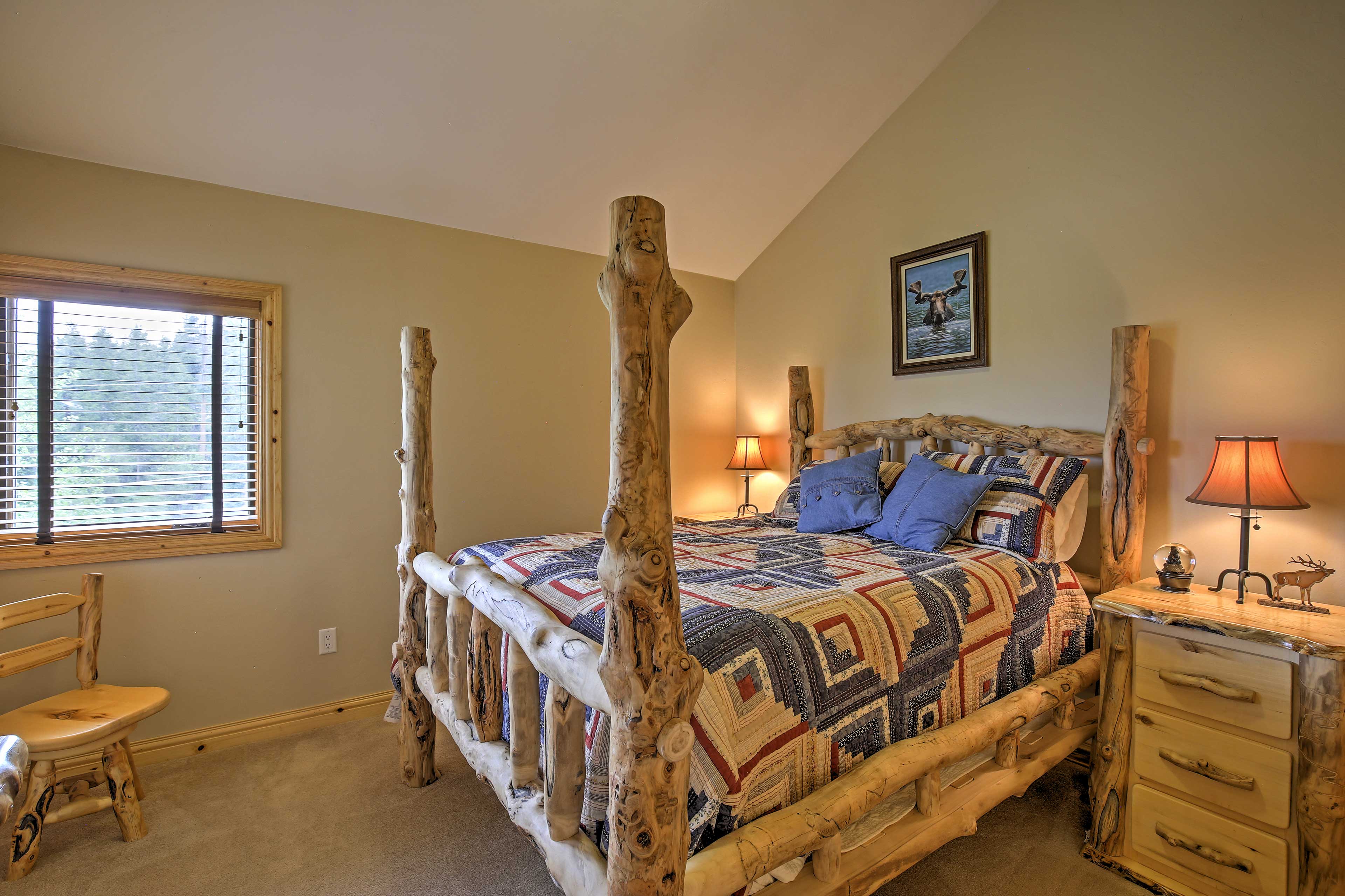 This bedroom boasts a queen bed.