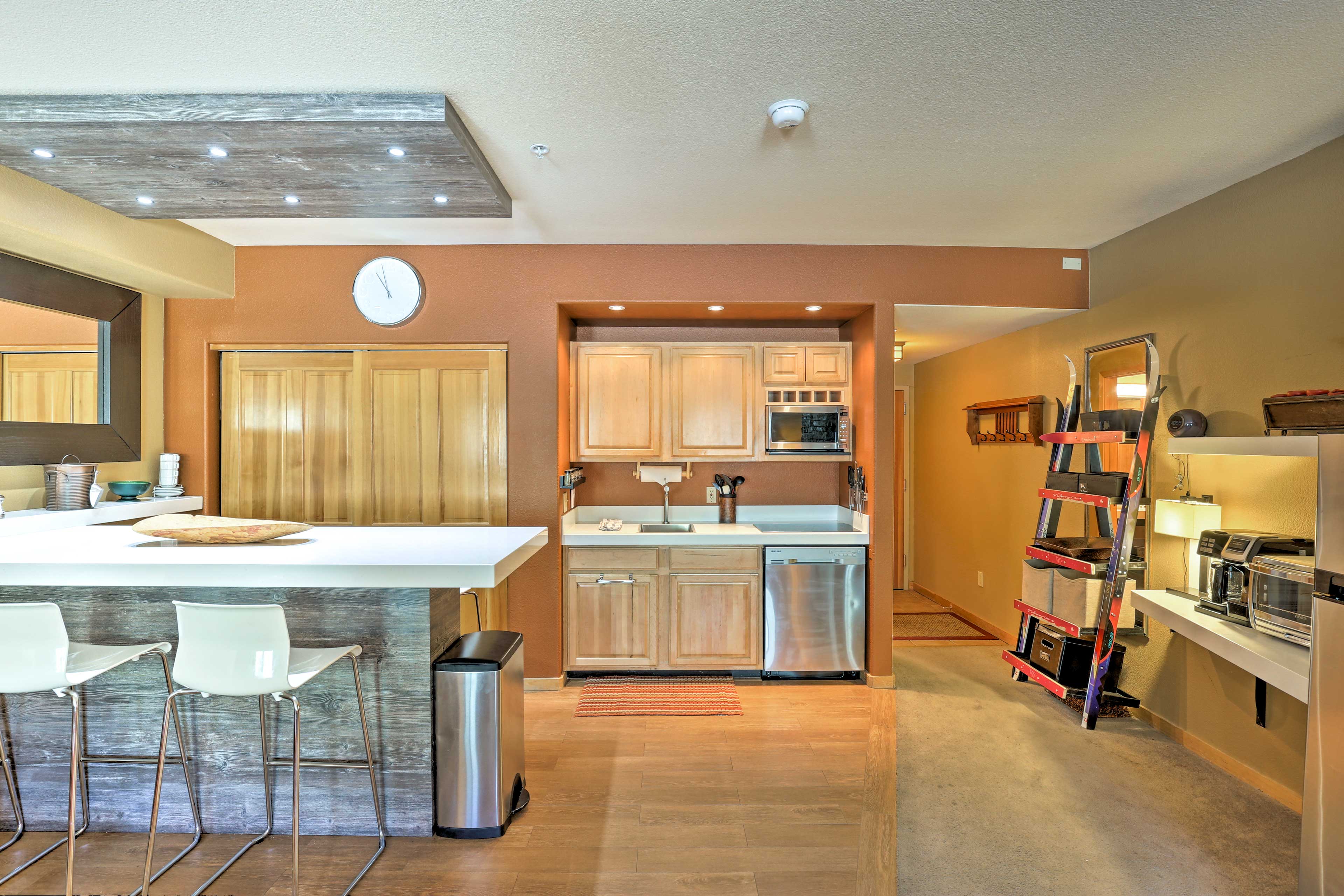 The kitchenette features stainless steel appliances.