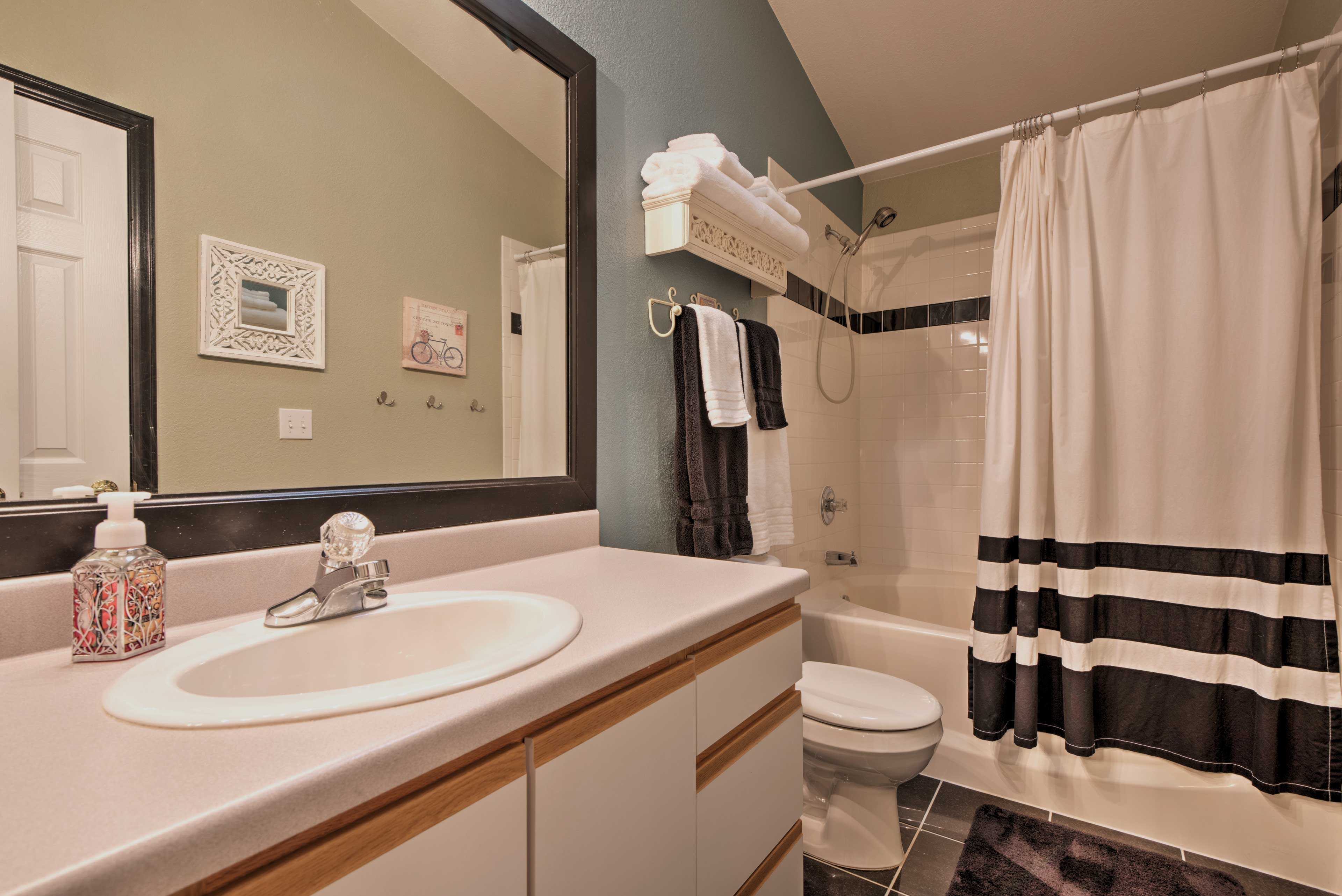 The bathroom features new fixtures and appliances.