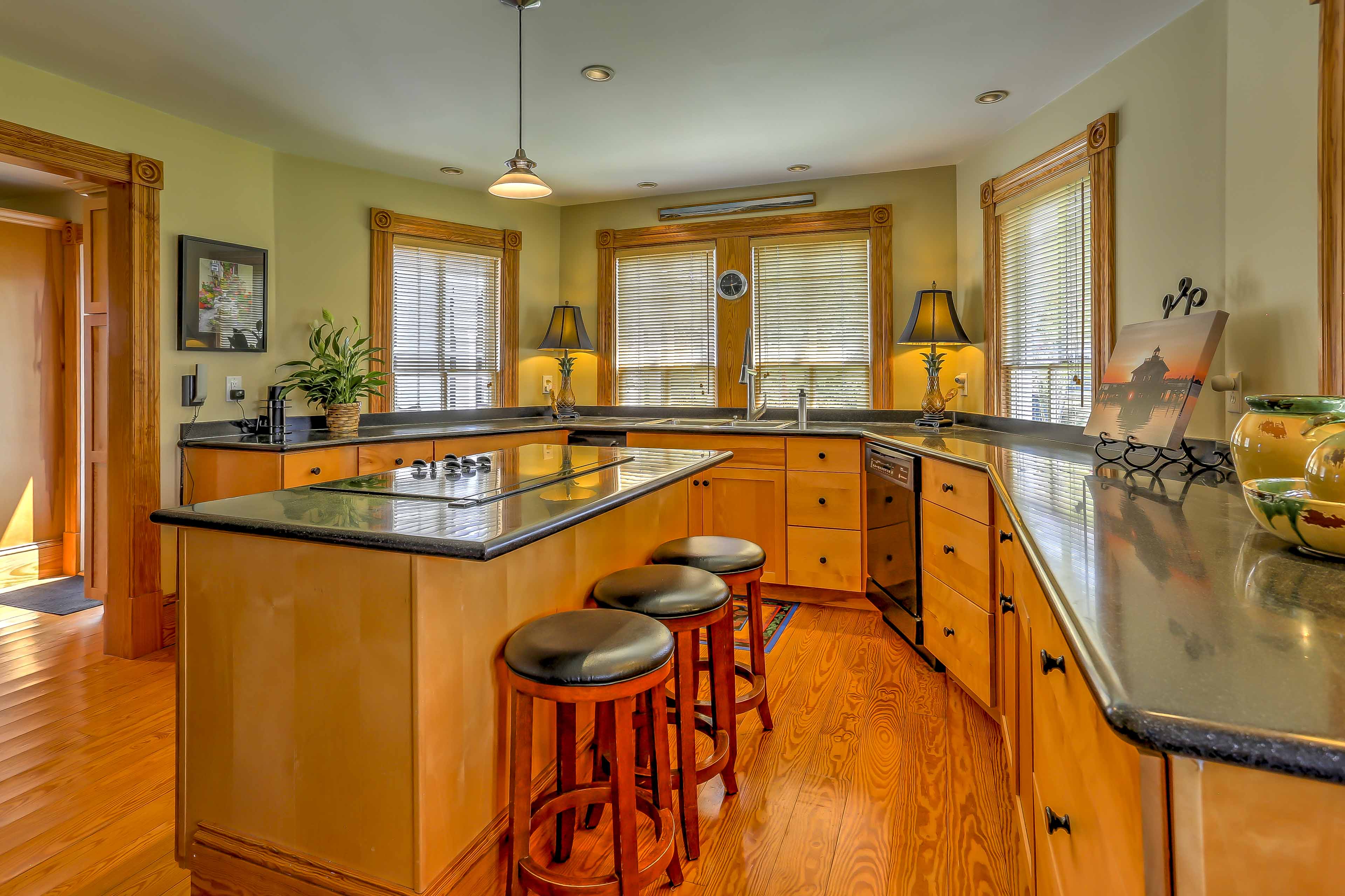 The kitchen boasts top quality appliances and a spacious center island.