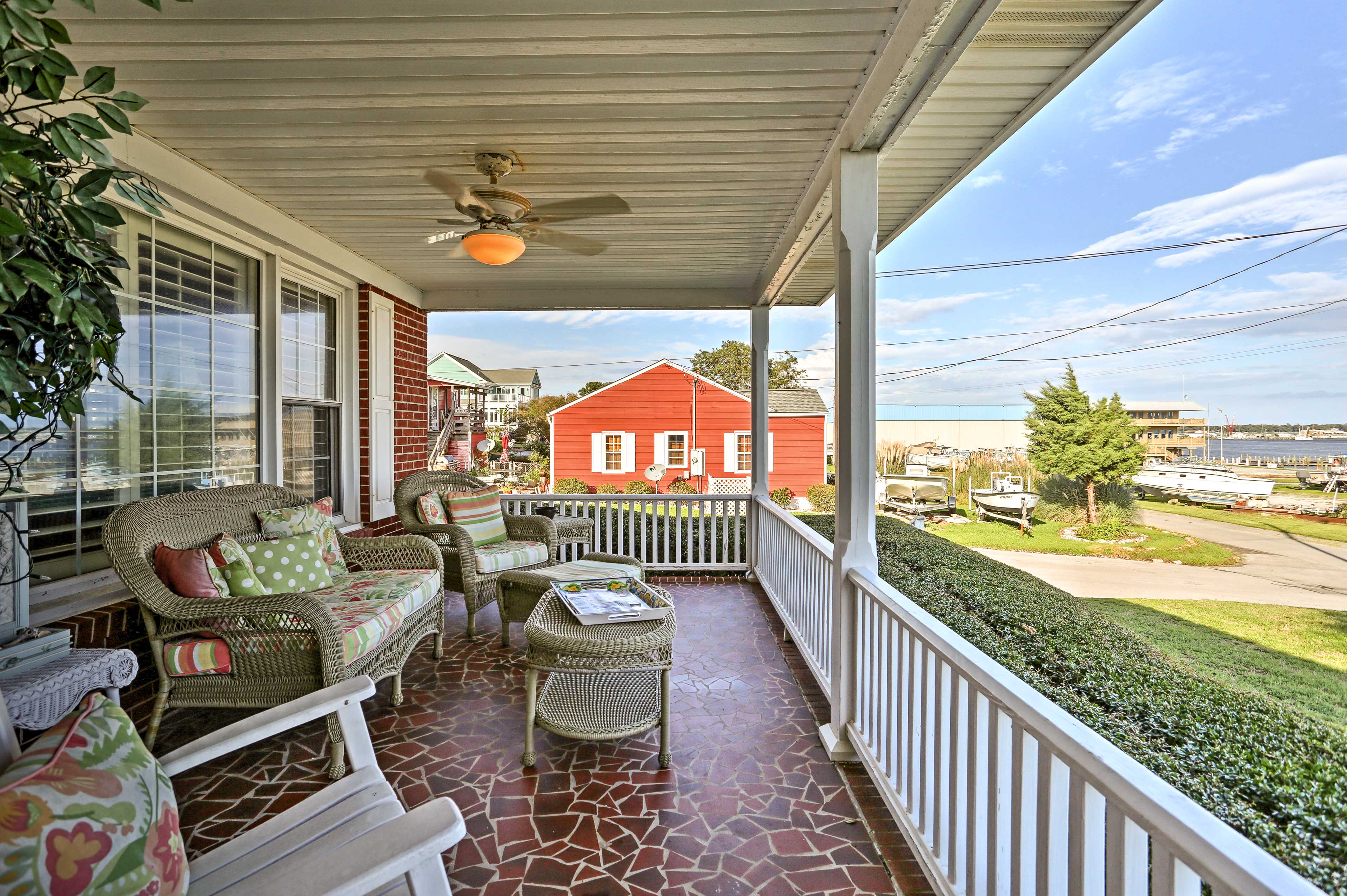 The front porch is sure to be a favorite spot during your stay with water views!