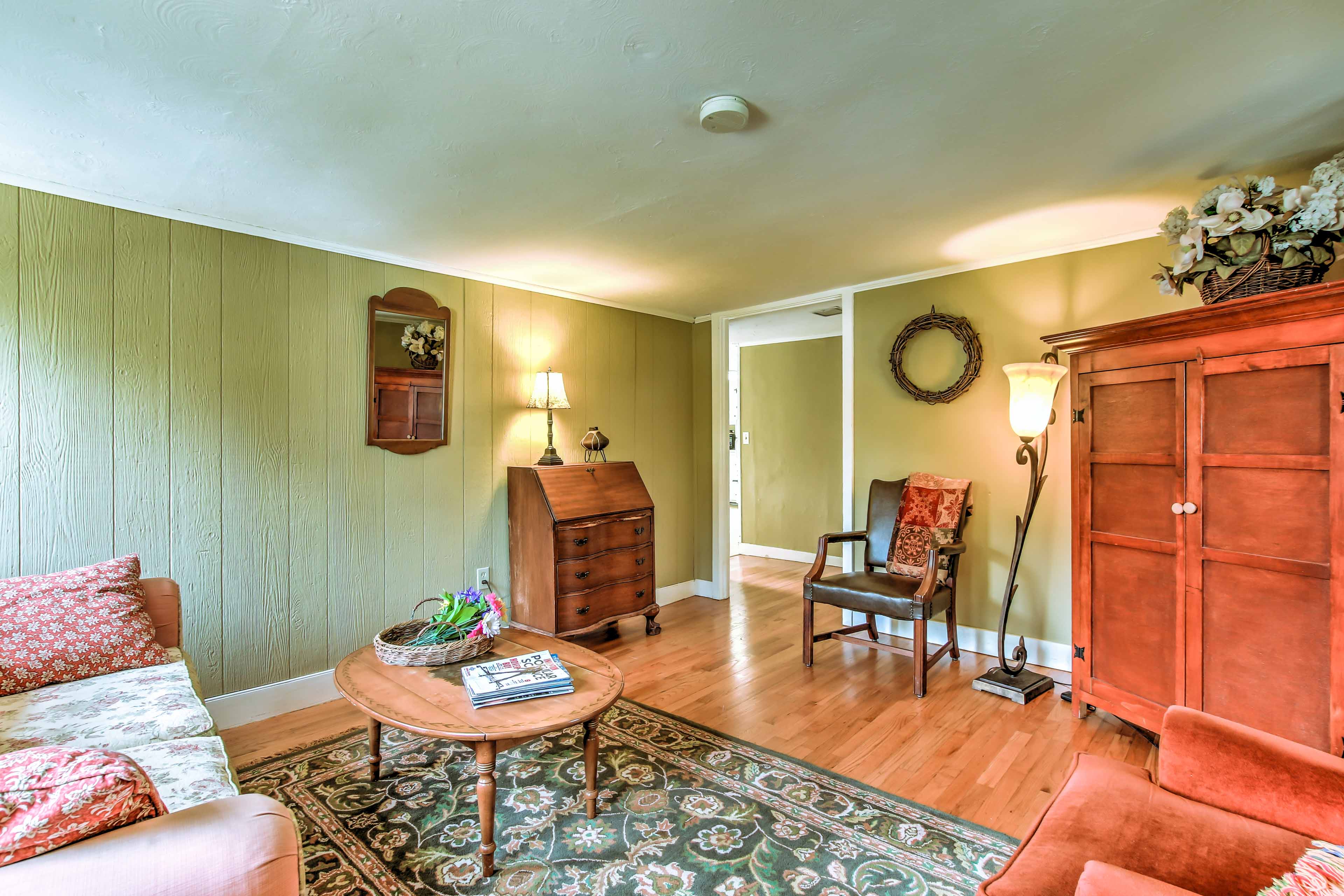 You'll find hardwood floors and antique furniture throughout the apartment.