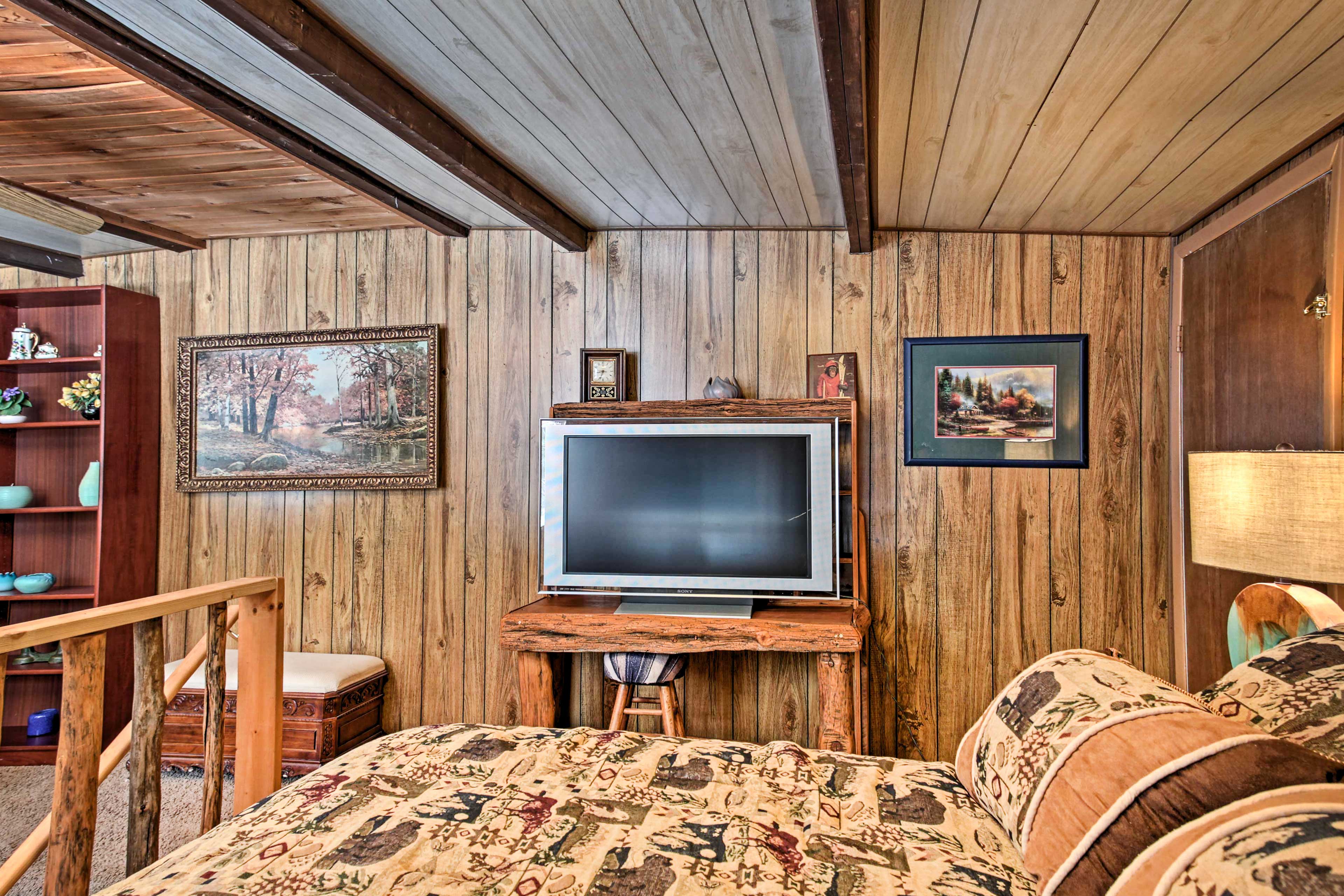 Tune into your favorite shows on the flat-screen TV in the loft bedroom.