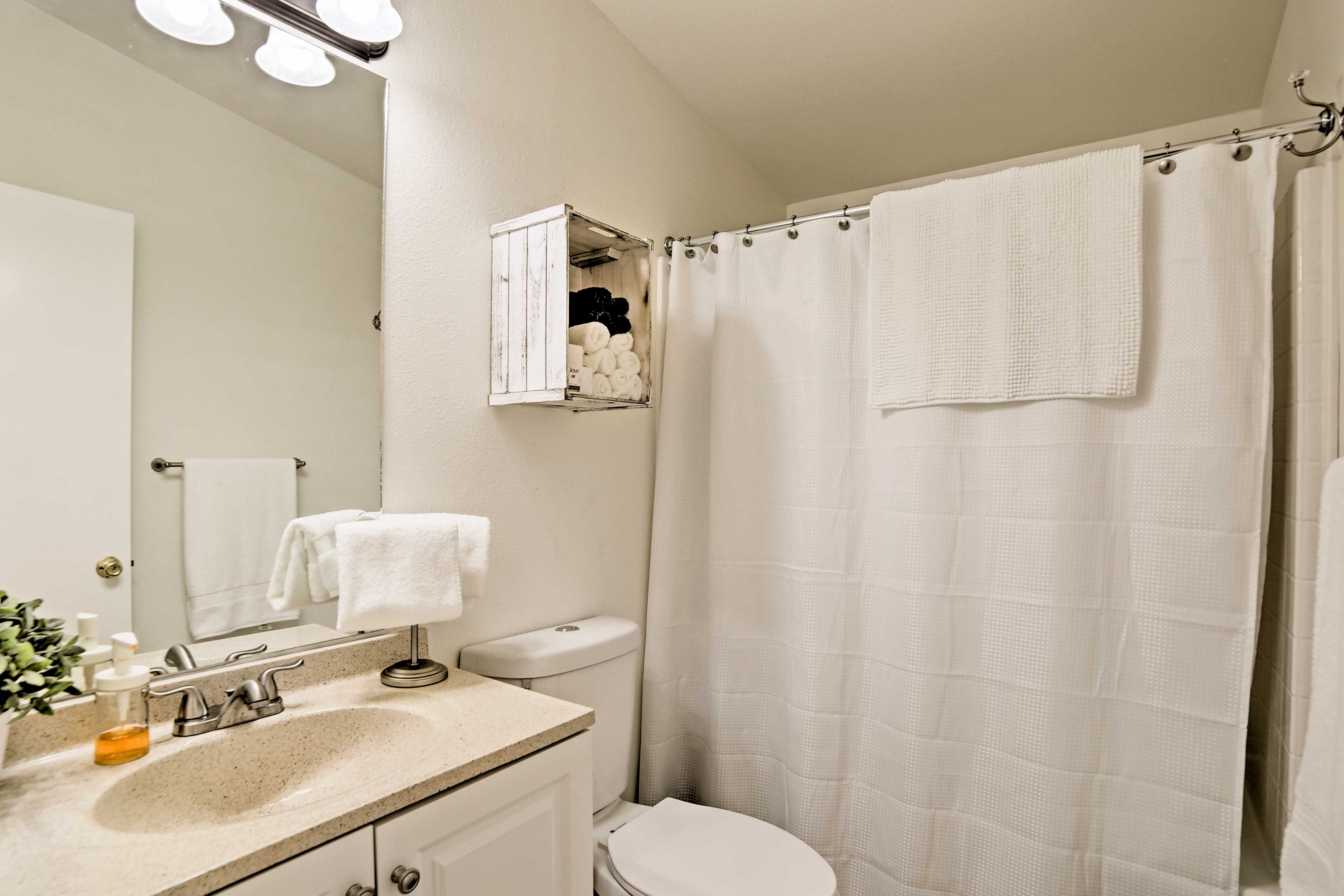 Rinse off in this pristine, newly renovated bathroom.