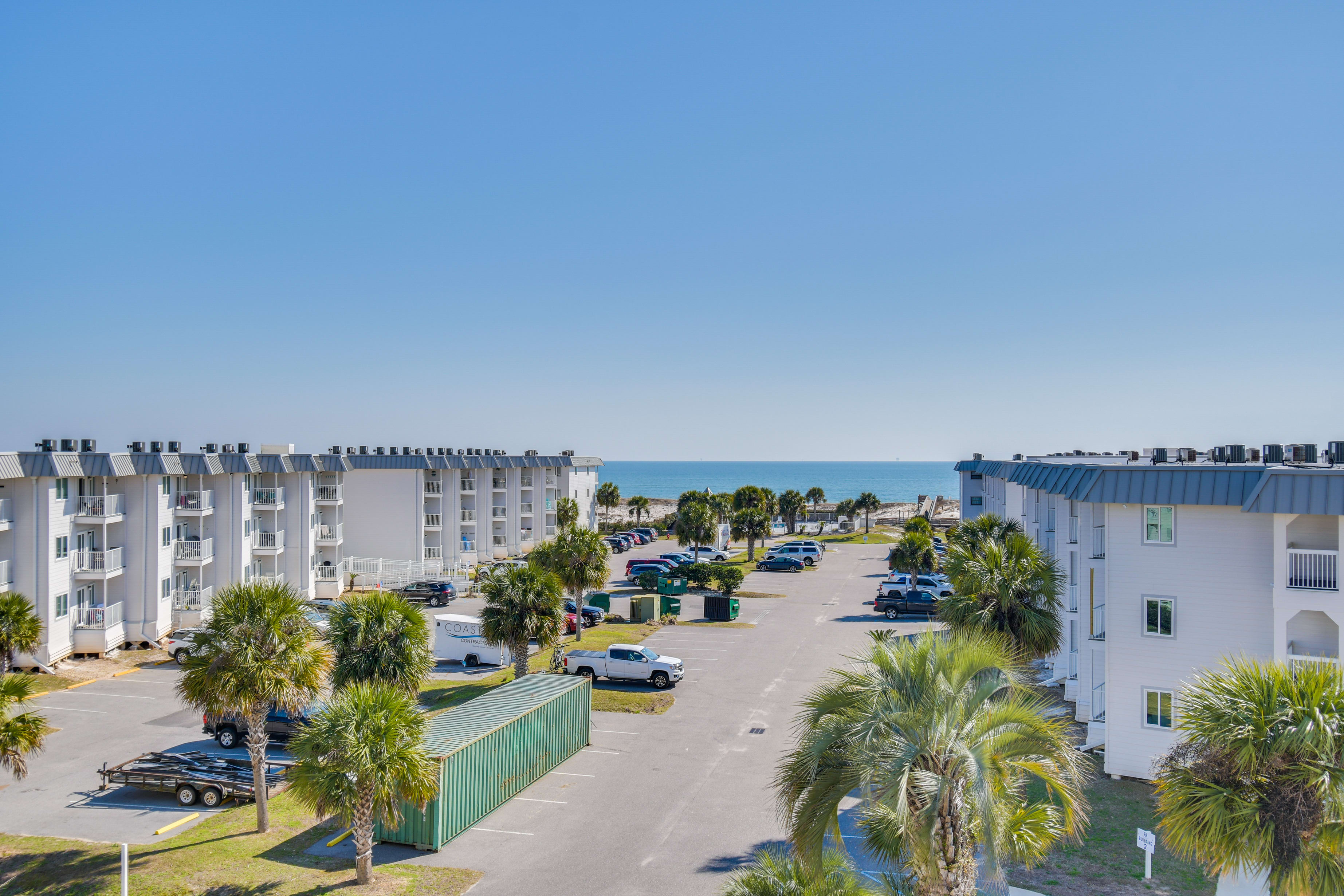 Condo Exterior | Community Surface Lot (2 Vehicles) | Beach Access