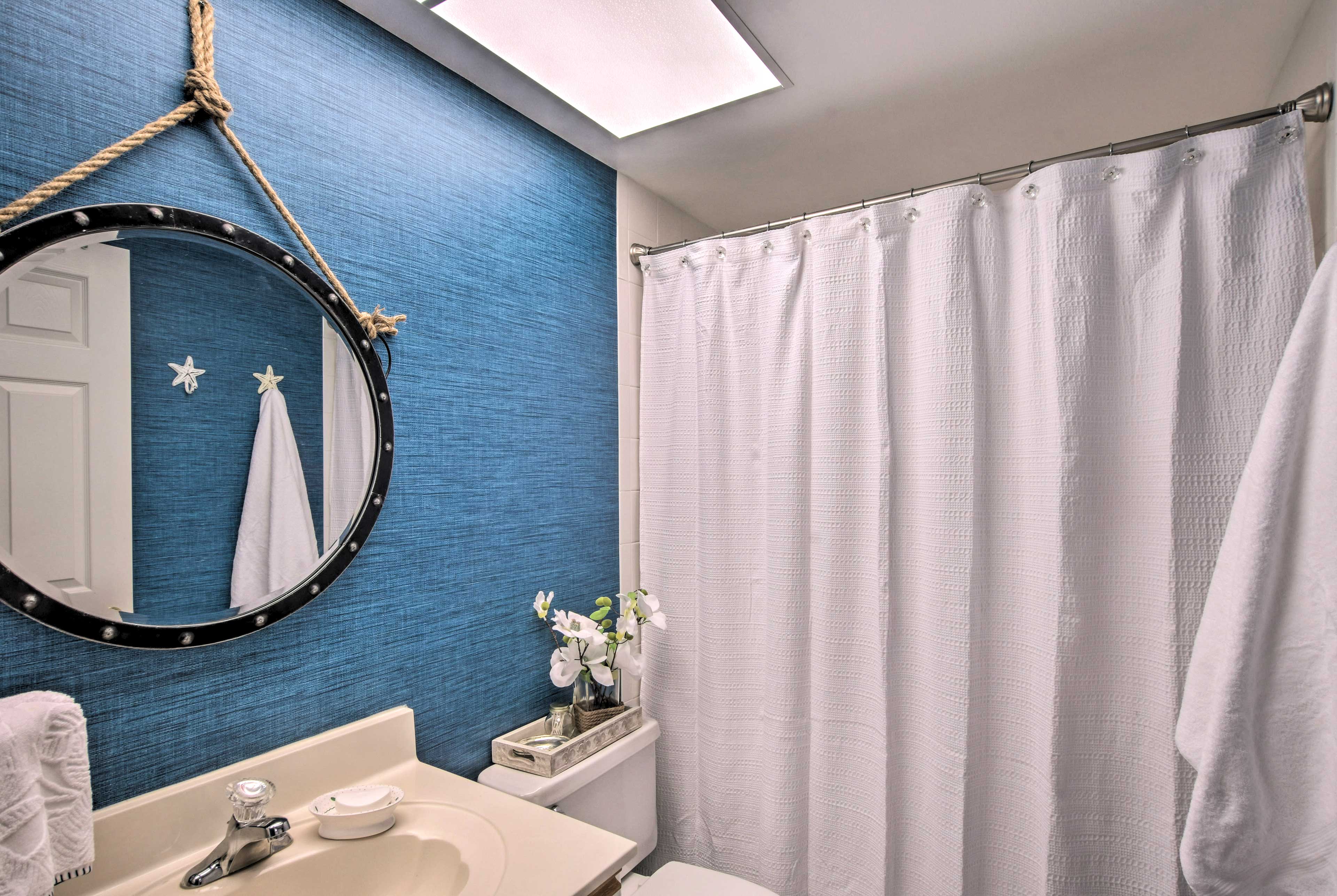 Freshen up in this bright blue bathroom.