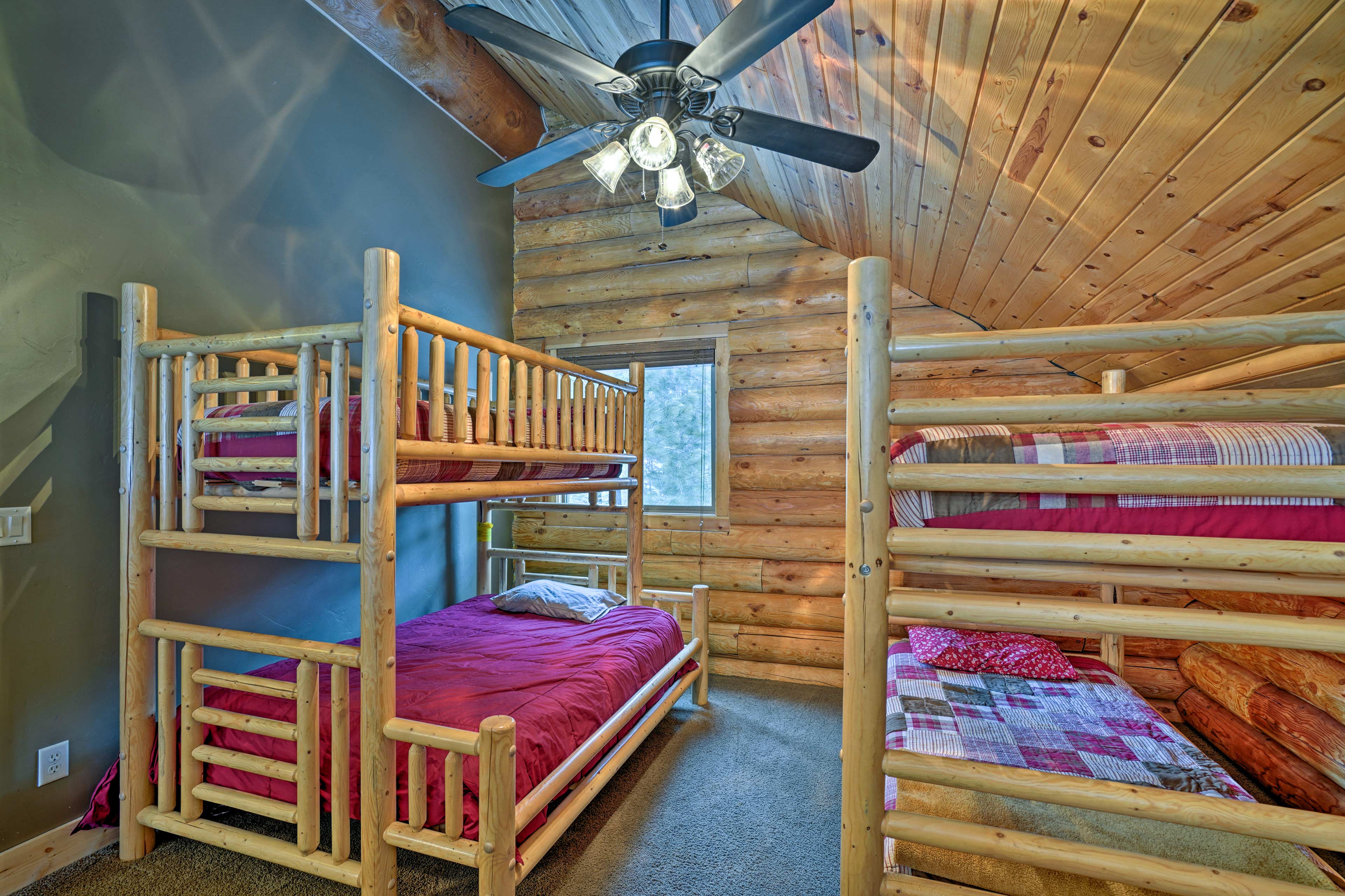 The sleeping loft hosts a Twin-over-Twin Bunk Bed and Twin-over-Full Bunk Bed.