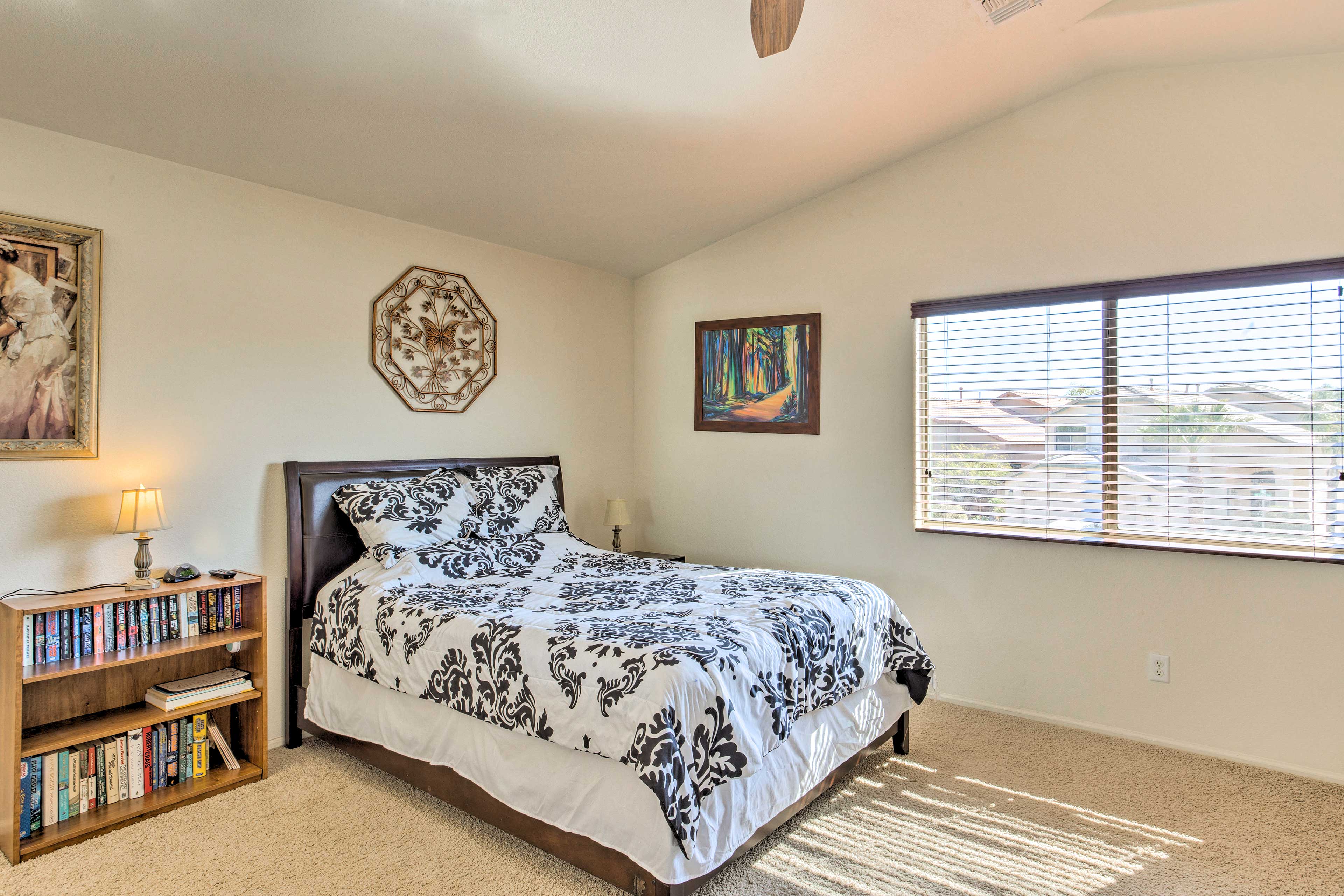 This bright and breezy bedroom is adorned with a queen bed & en-suite bathroom!