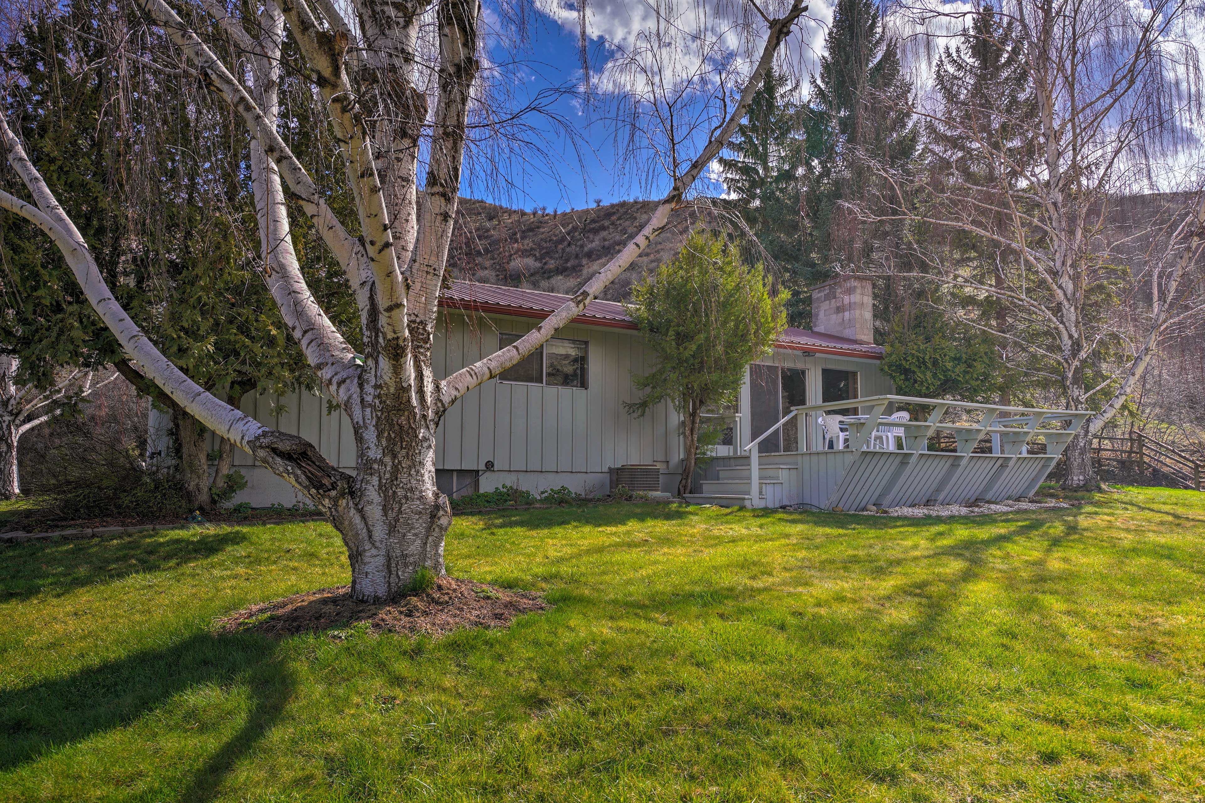 The Salmon River runs through the beautiful mountains around this Idaho home.