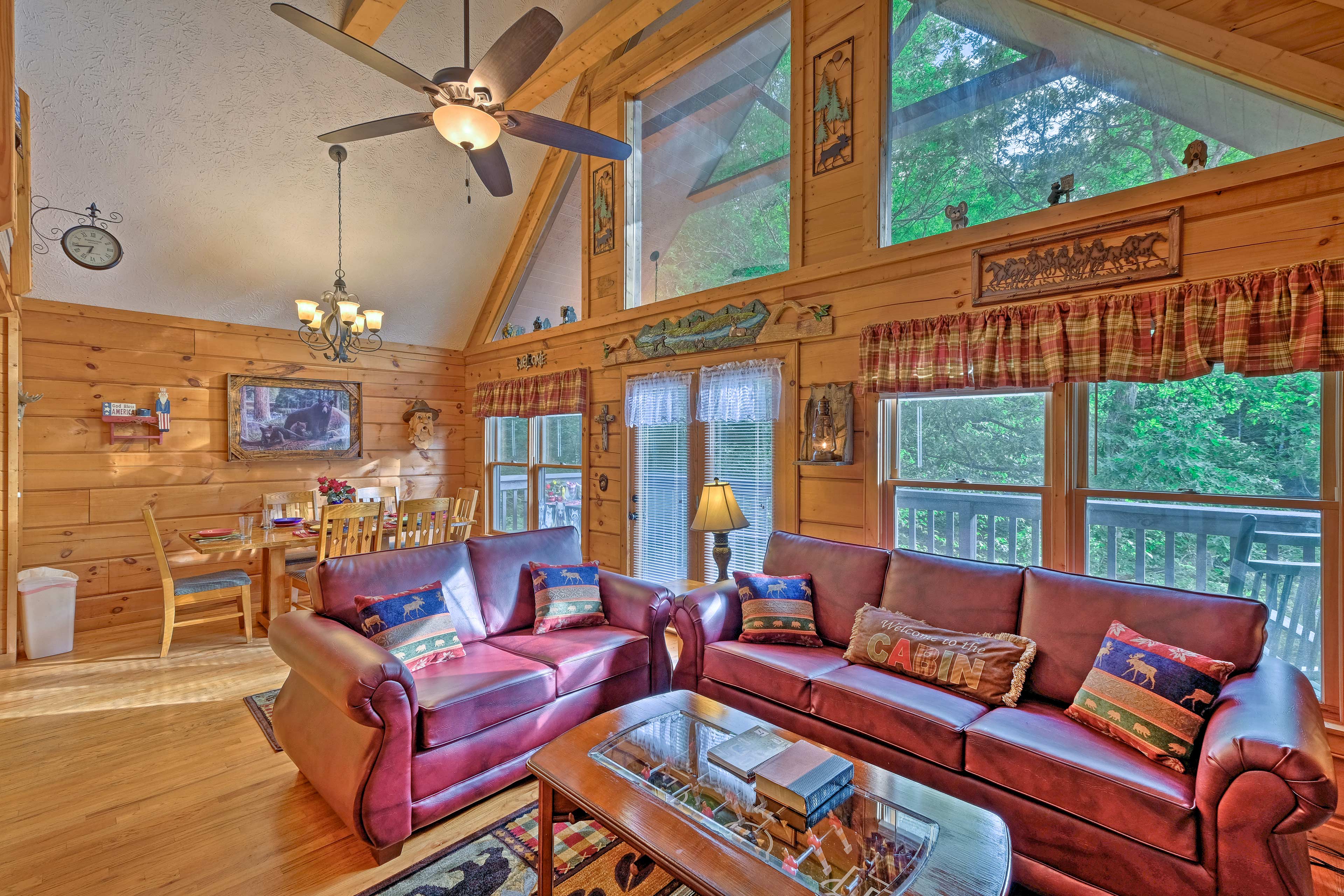 The living room boasts floor-to-ceiling windows.