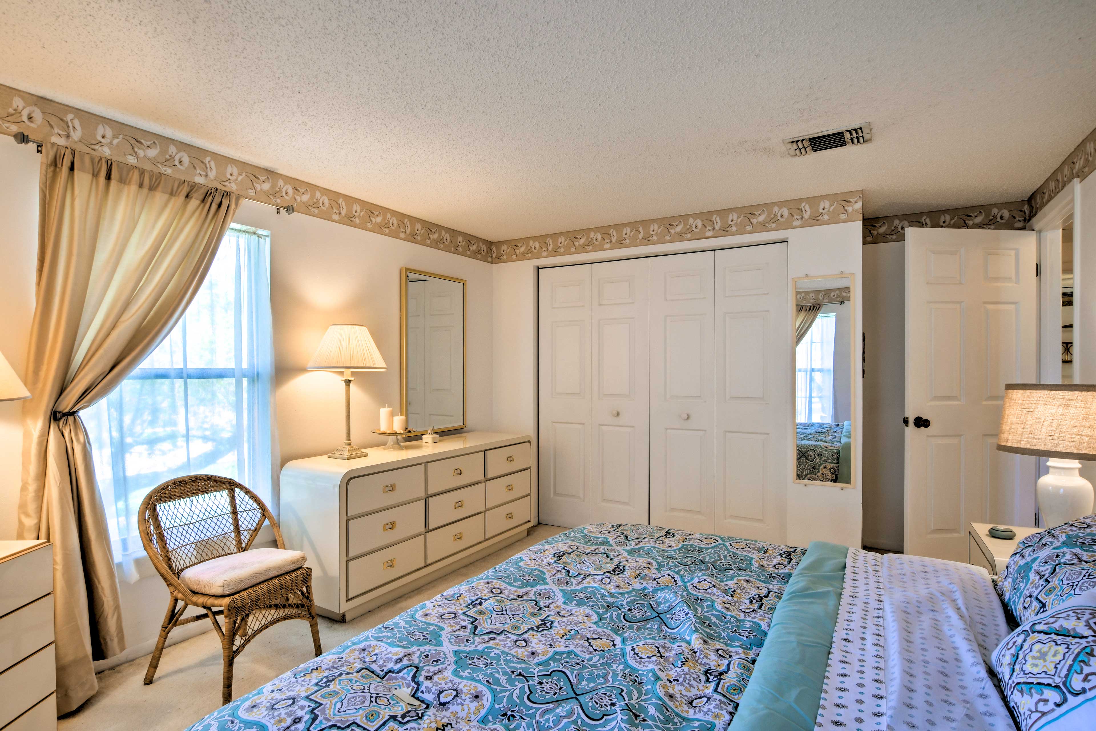 This bedroom is bright and airy.