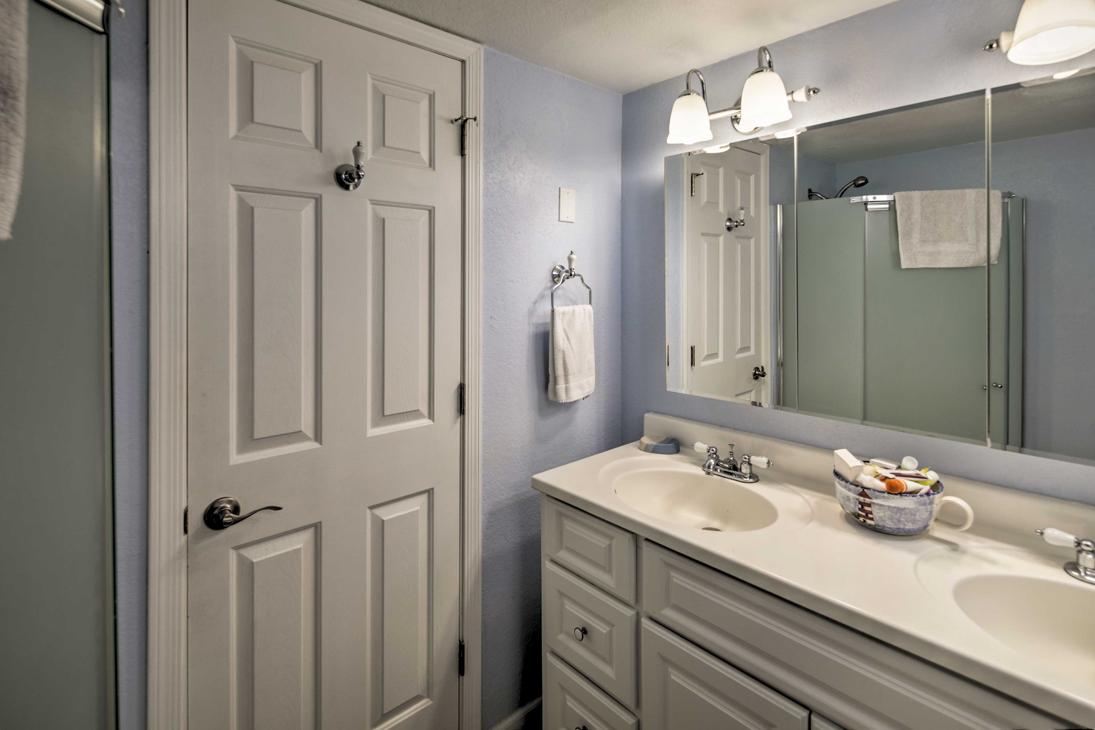 Utilize the walk-in shower found in the second bathroom.