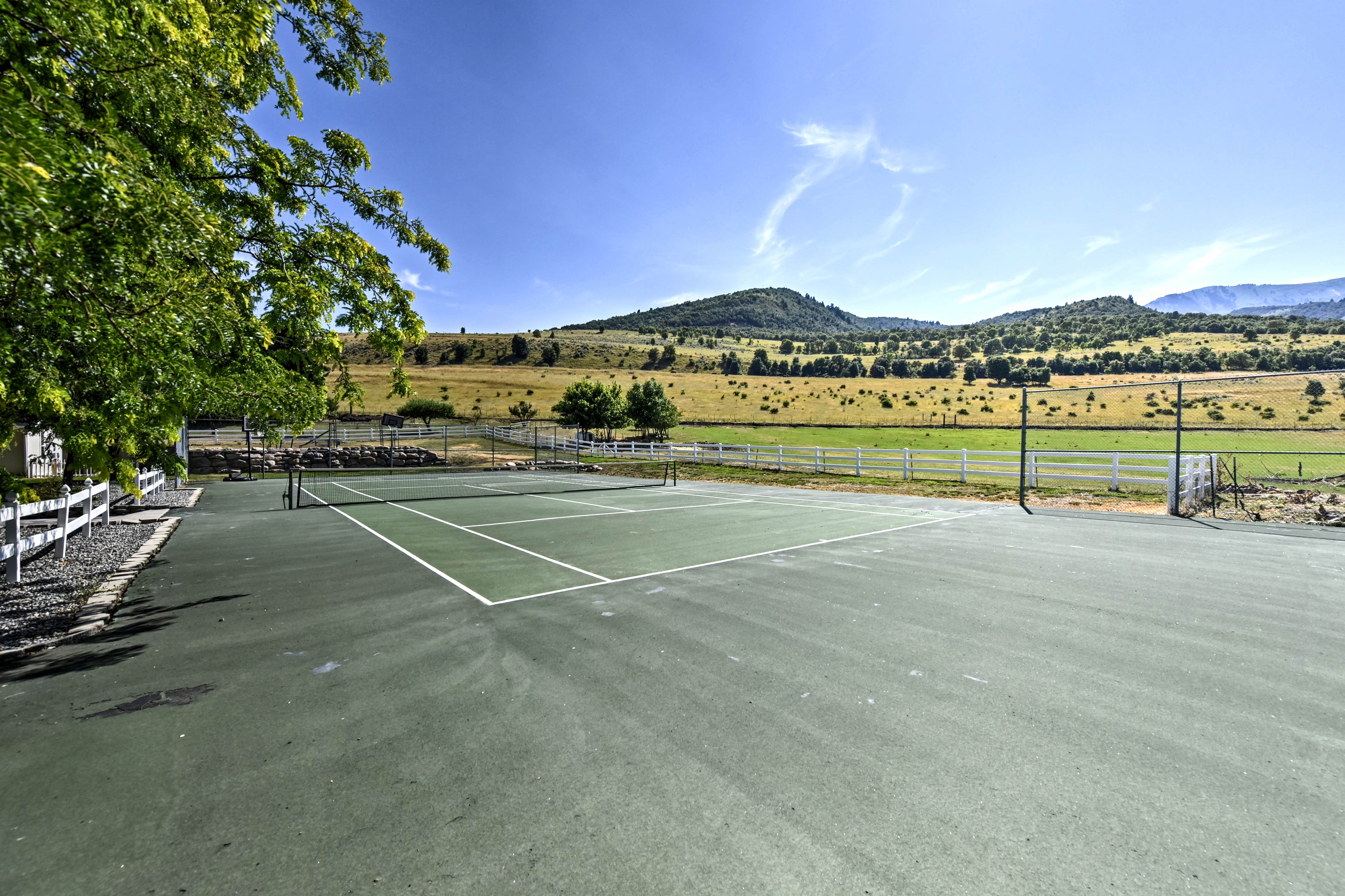 'Mountain View Retreat' features a tennis court and panoramic mountain views.