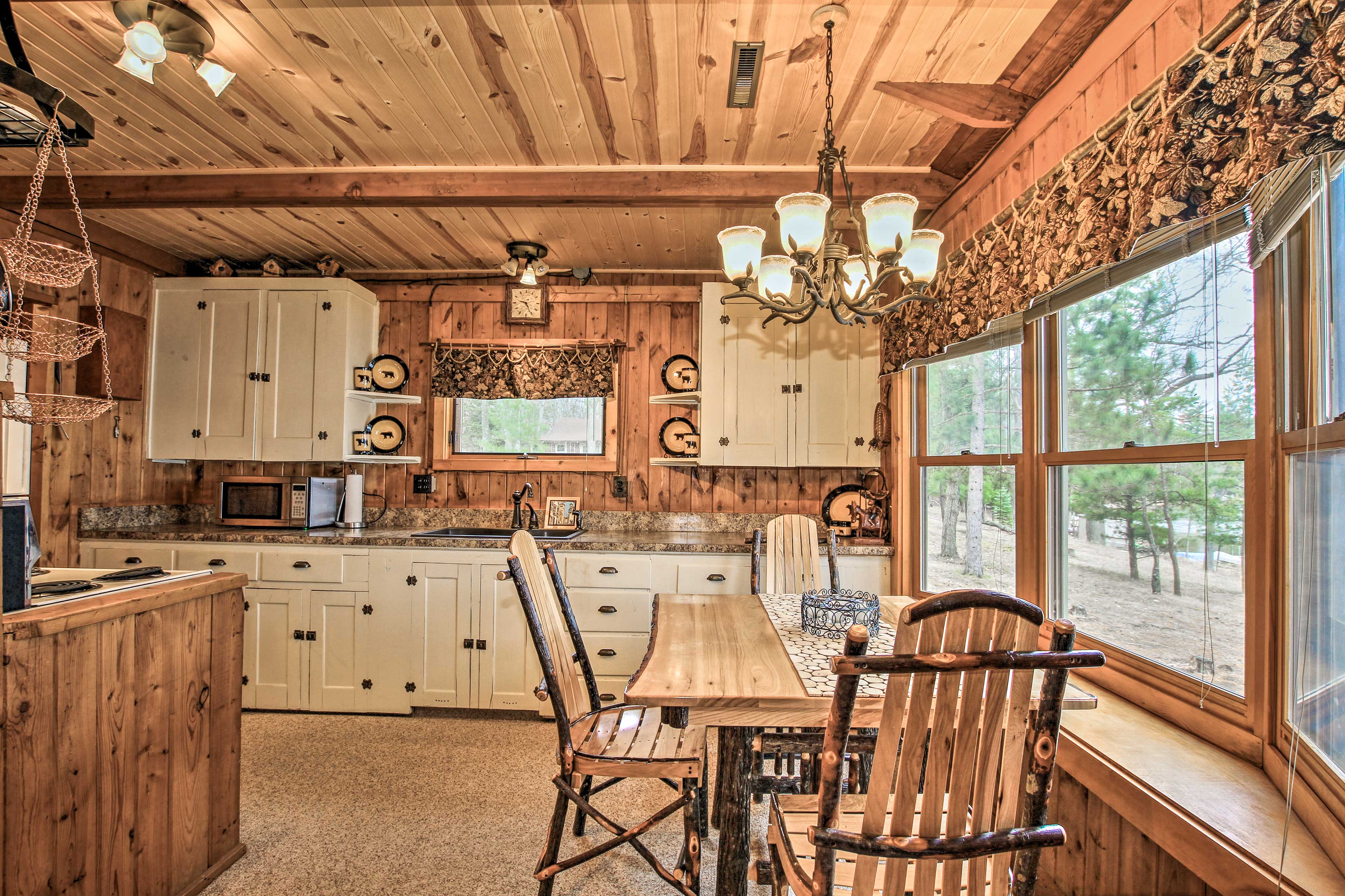 This wooden dining table is the perfect place to enjoy a meal.