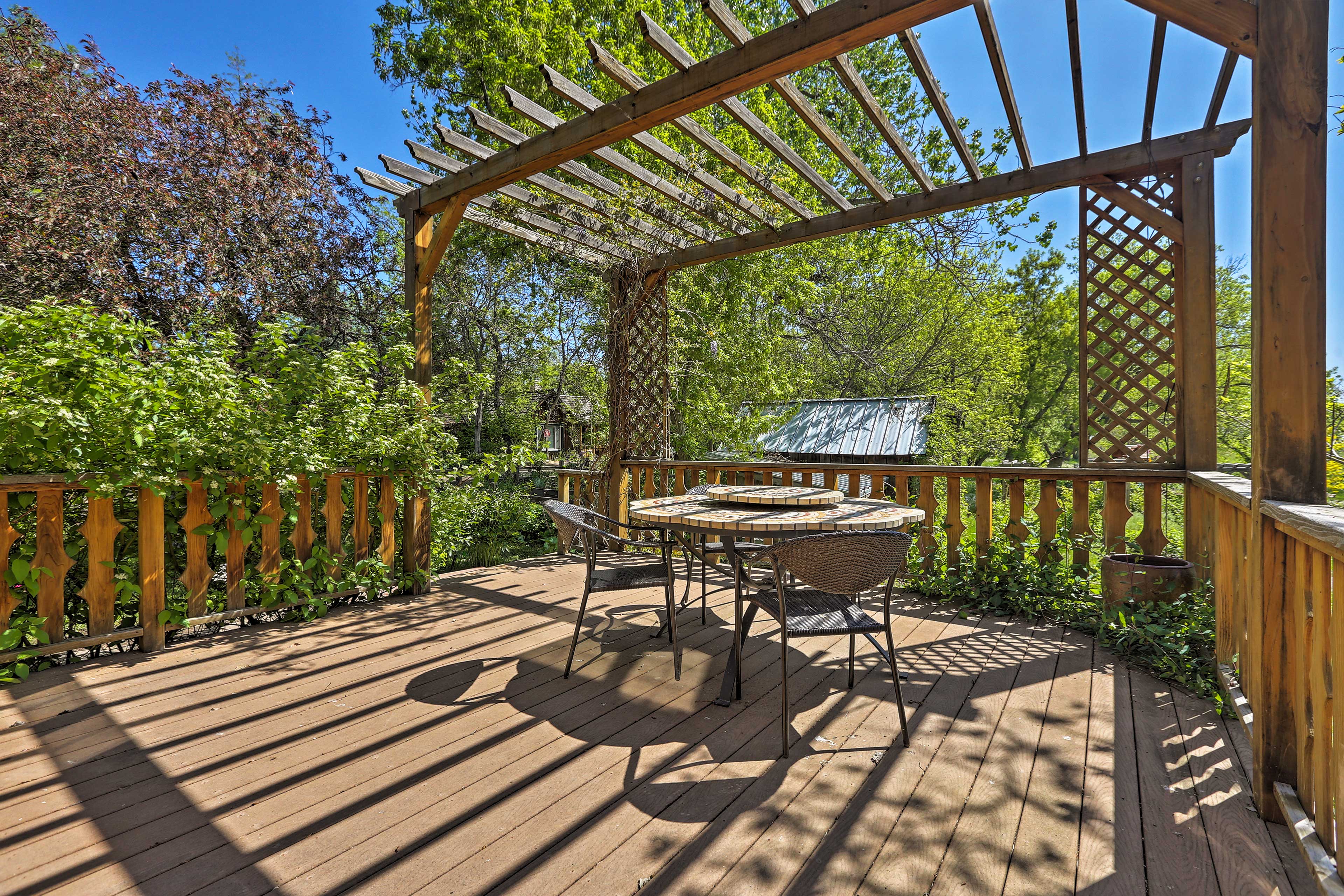 Grab a bottle of wine to enjoy under the pergola.