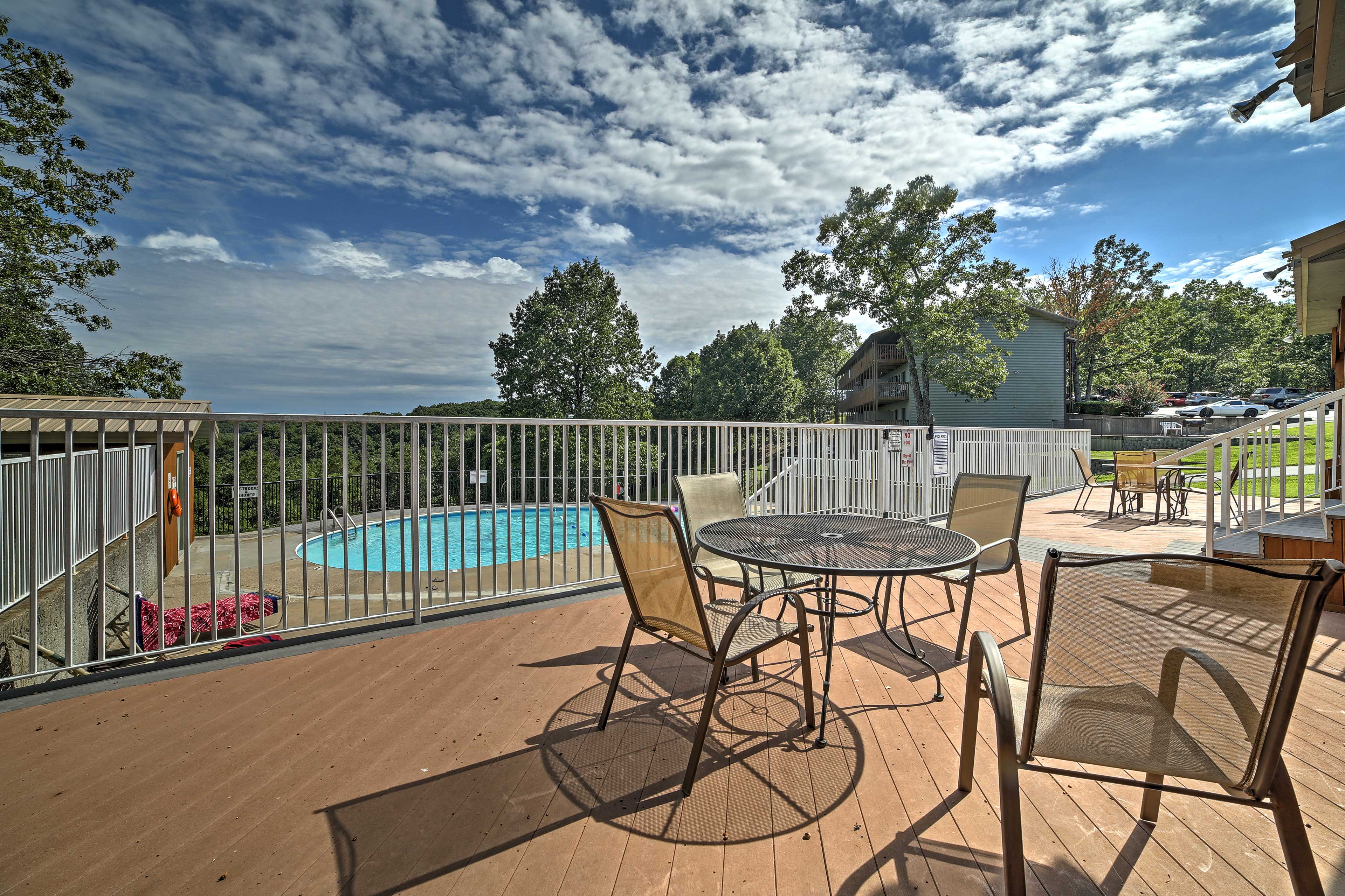 While your kids swim, relax at a cozy dining table.