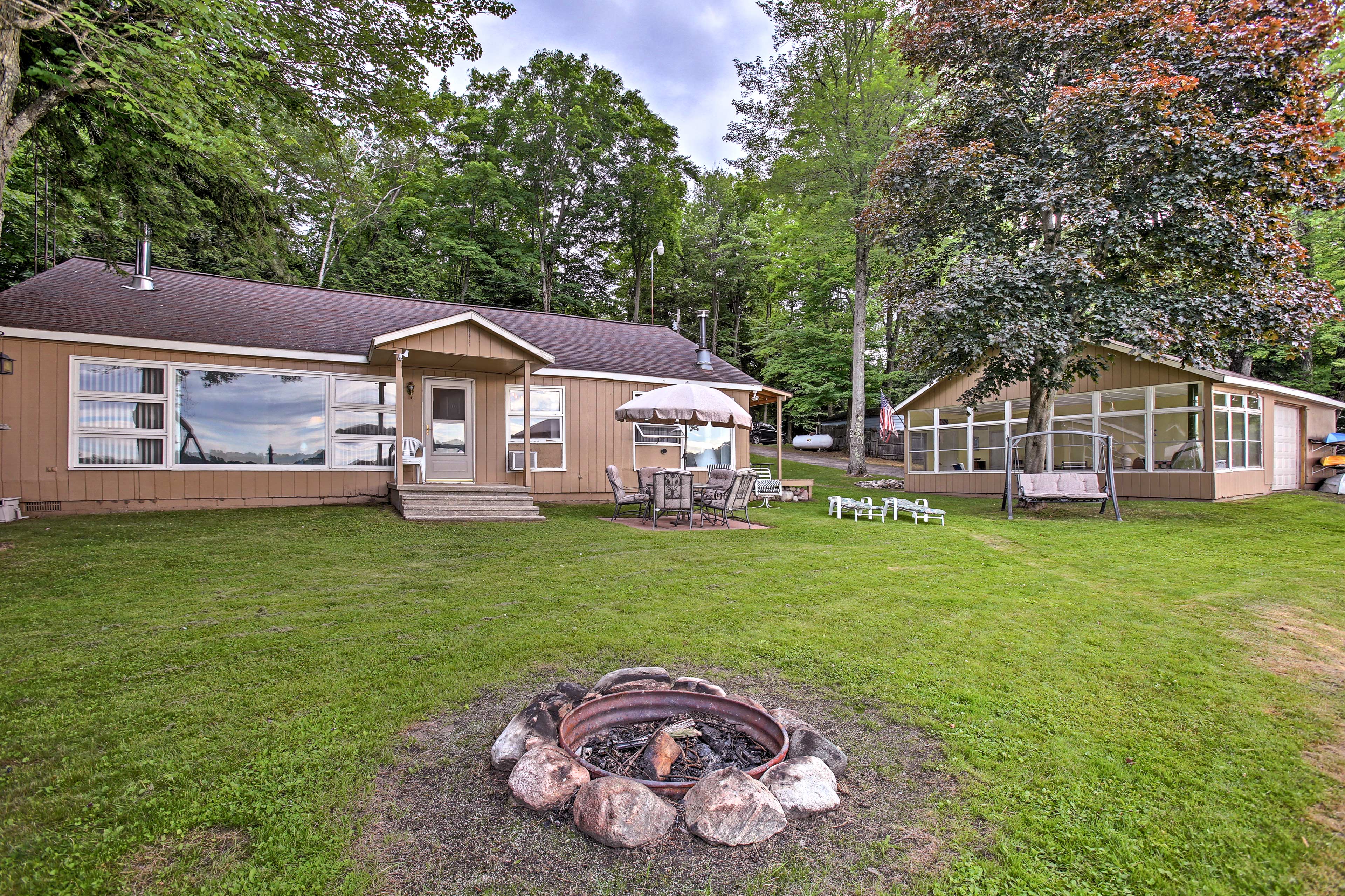 Make yourself at home on Rose Lake at this waterfront vacation rental cabin!