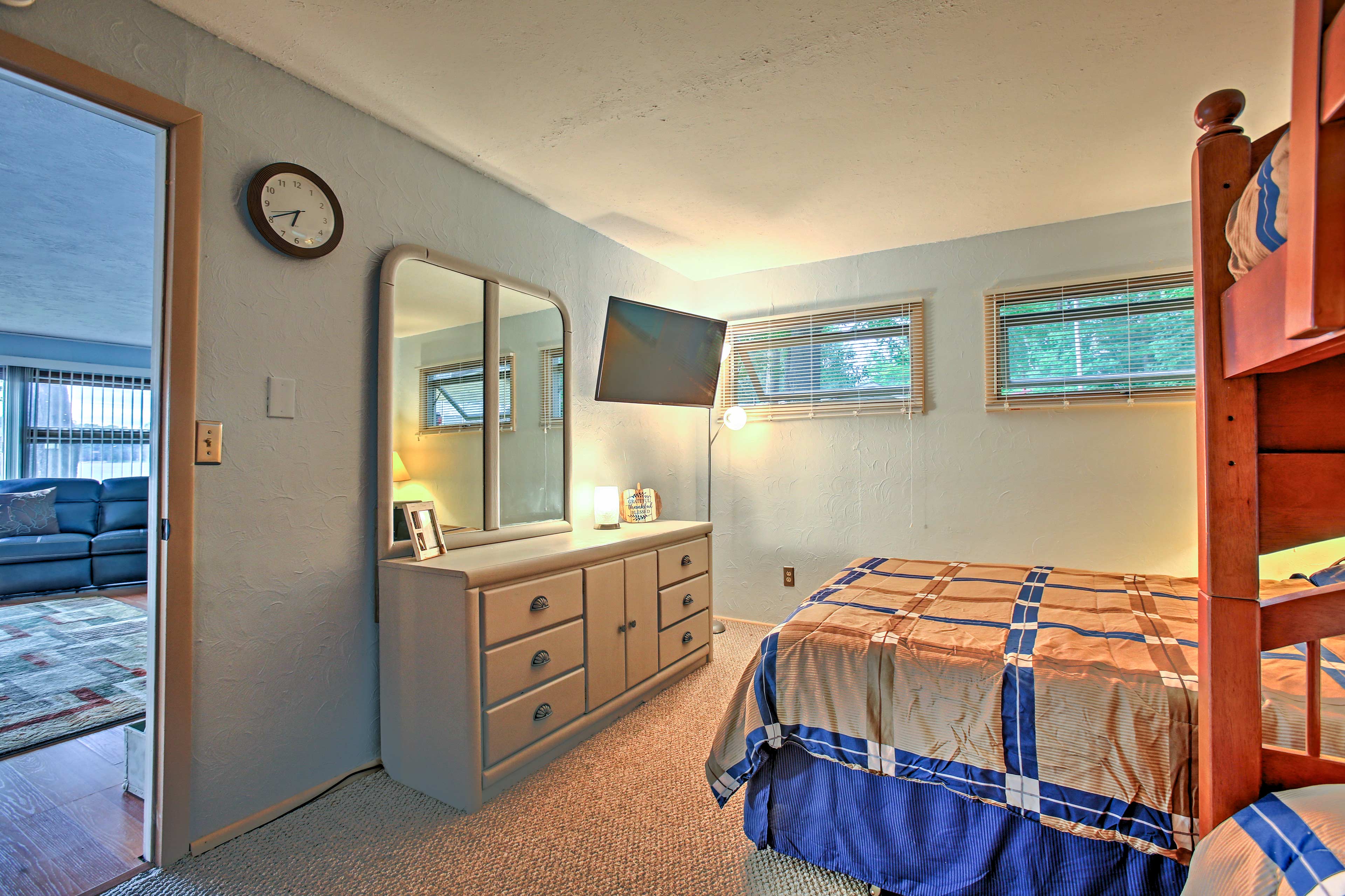 The room sleeps 4 on a queen bed and twin bunk bed.